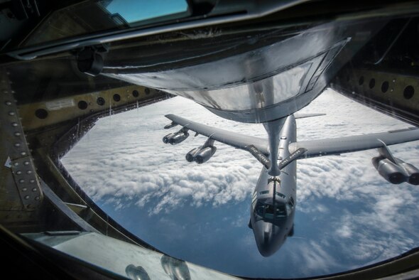 A KC-135 Stratotanker connects with a B-52H Stratofortress from Minot Air Force Base, N.D., during an aerial refueling mission over the Alaskan coastline as part of exercise Amalgam Dart 15-2 May 28, 2015. The annual North American Aerospace Defense Command exercise affords American and Canadian forces field training aimed at improving NORAD's operational capability in a binational environment. The exercise spanned two forward operating locations in Canada’s Northwest Territories, two U.S. Air Force bases in Alaska, and a mobile radar site in Resolute, Nunavut, as well as the sky over much of NORAD’s area of responsibility. (U.S. Air Force photo/Staff Sgt. Benjamin W. Stratton)
