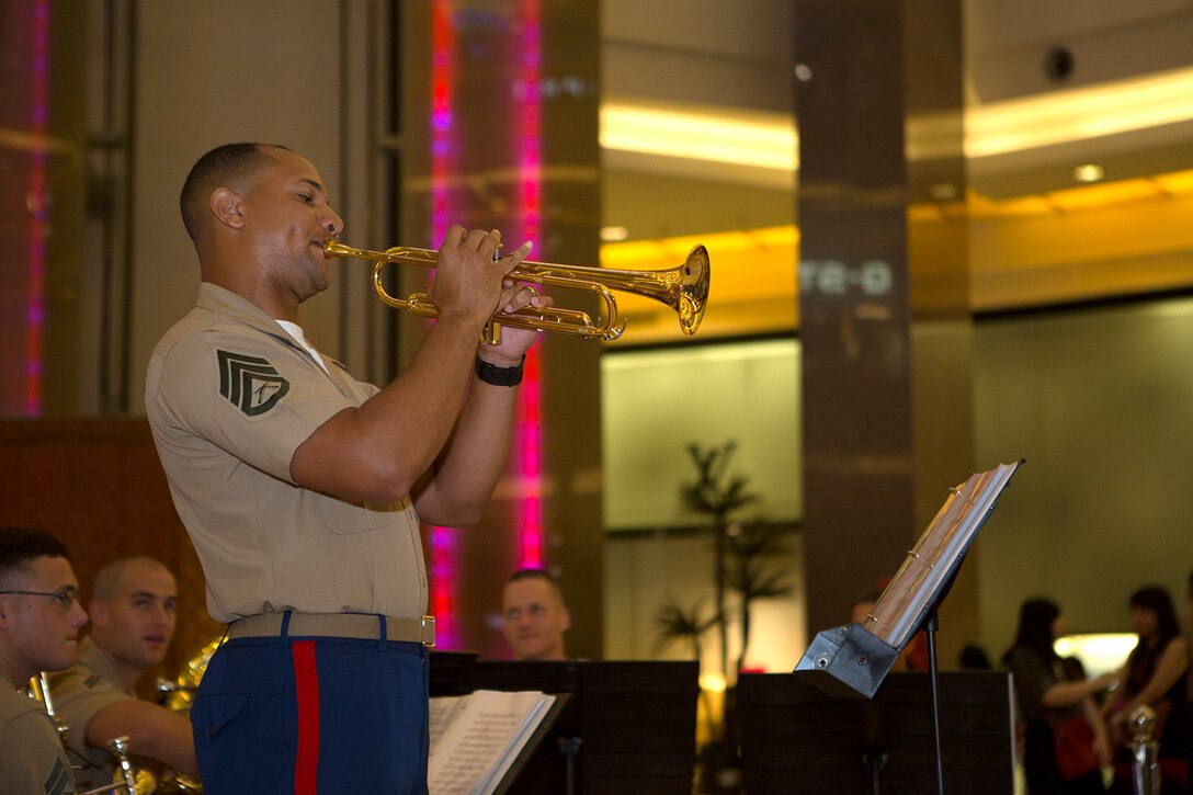 Staff Sgt. Jerry Williams, a member of the U.S. Marine Corps Forces, Pacific Band’s Brass Quintet, performs a trumpet solo for local citizens during an evening show at the Pacific Palace Mall, Jakarta, Indonesia, June 2, 2015. This trip marks the first time that the MARFORPAC Band has visited Indonesia. The show was the first of several scheduled for the local population.