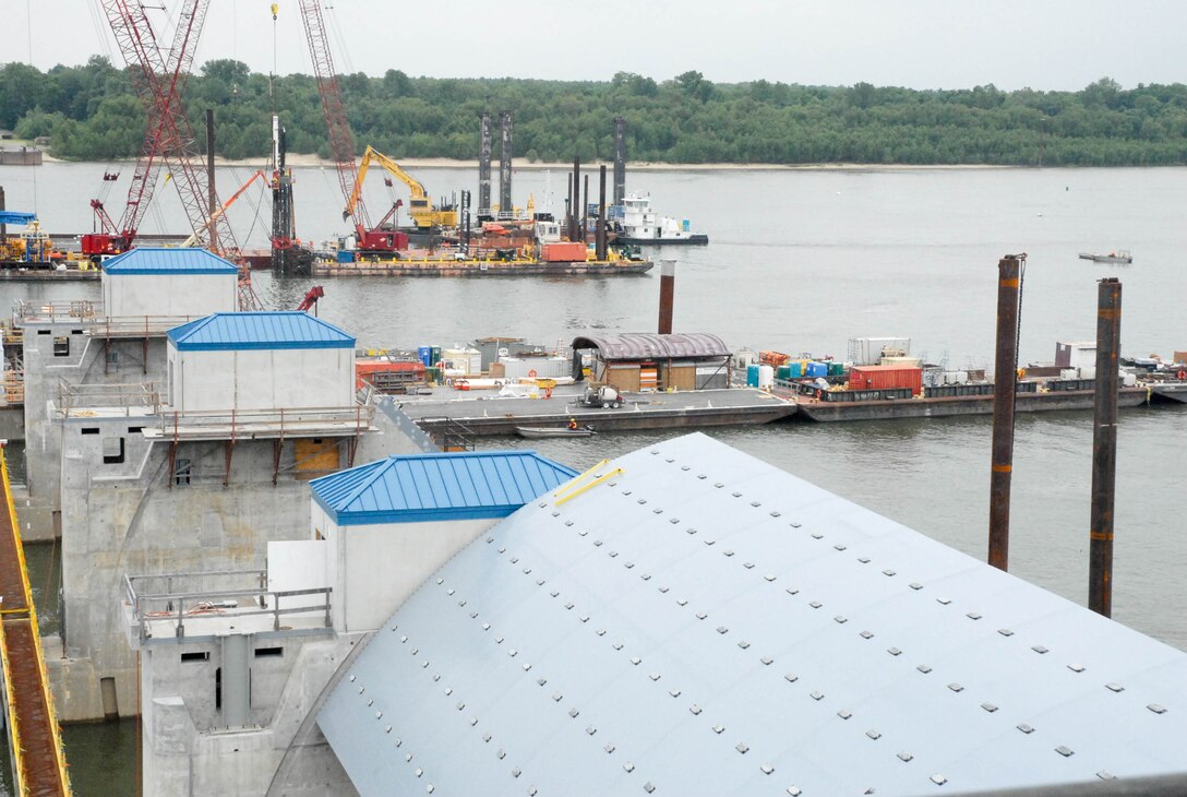 Construction work continues as the low water season on the Ohio River is officially underway.
In the foreground is the first tainter gate that was installed in 2014. A second tainter gate is to be installed later in June or early July. In the background, the fleet does some grading work.
