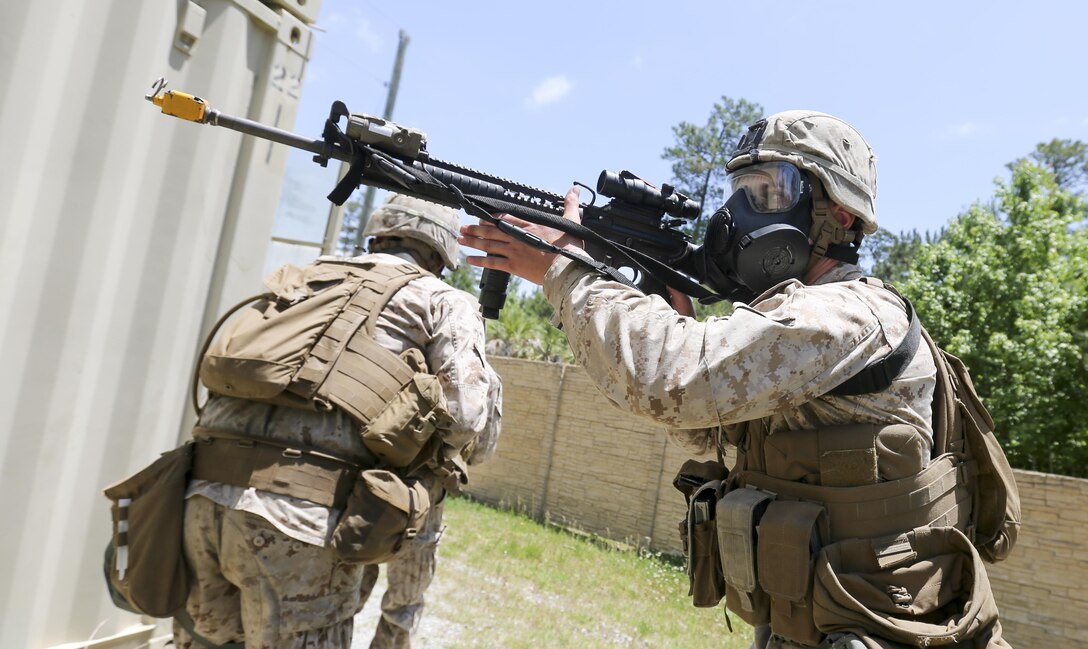 Marines with Company E, Battalion Landing Team 2/6 conduct military operations in urban terrain (MOUT) training at Mobile MOUT aboard Marine Corps Base Camp Lejeune, N.C., May 28, 2015. During the training, the Marines practiced patrolling, established vehicle checkpoints, and conducted  assault drills during day and night operations. (Photo by Staff Sgt. Bobby J. Yarbrough)