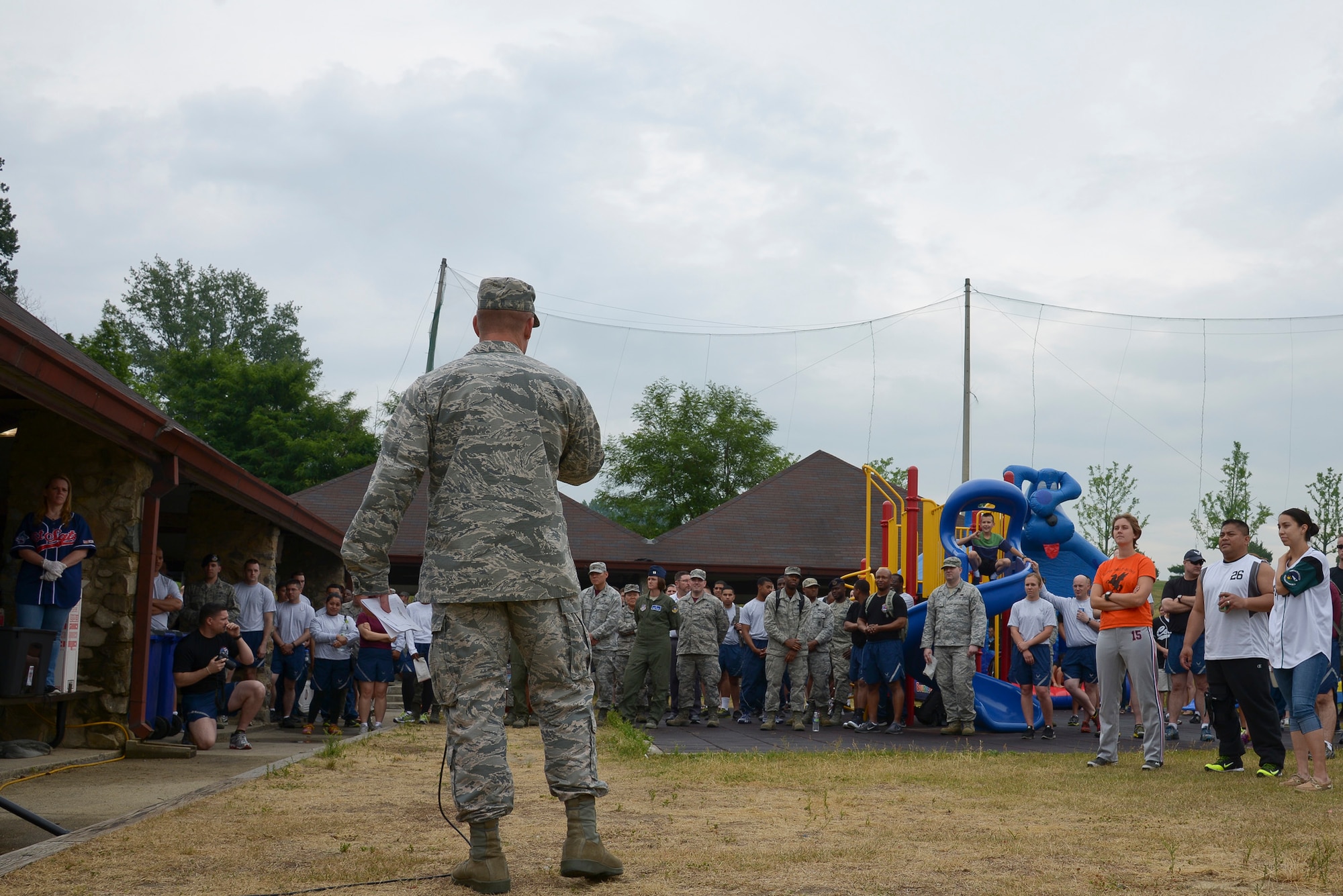 Col. Brook Leonard, 51st Fighter Wing commander, talks to Team Osan during a wing picnic June 5, 2015, at Osan Air Base, Republic of Korea. The picnic was to celebrate the completion of the 51 days of resiliency which challenged the base's personnel to look after each other and hone their physical, emotional, spiritual, and mental strength. (U.S. Air Force photo by Staff Sgt. Jake Barreiro)