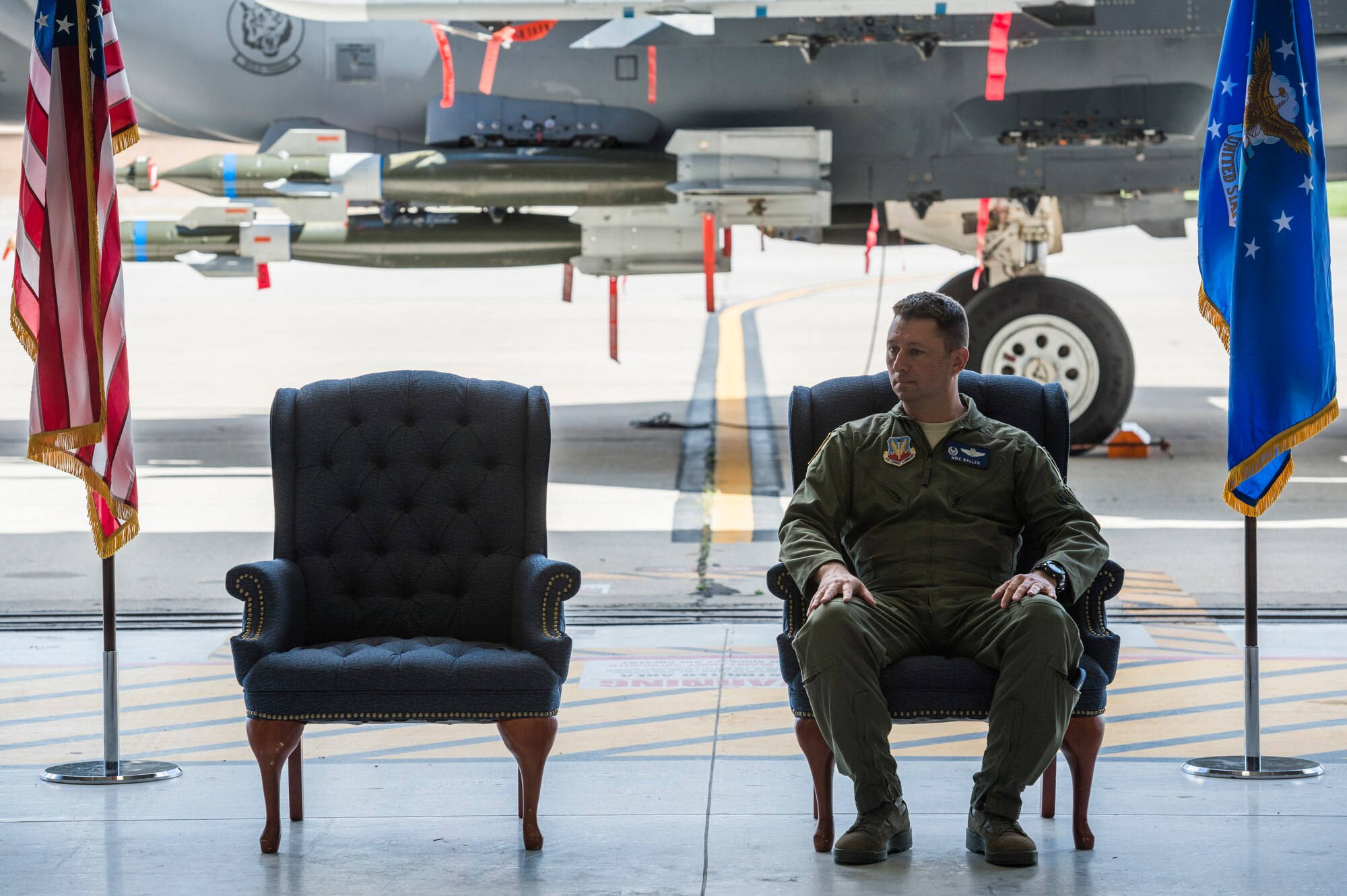 Col. Michael Ballek listens to Col. David Iverson, 366th Fighter Wing commander, as he speaks during Ballek's retirement ceremony at Mountain Home Air Force Base, Idaho, June 2, 2015. Ballek ended his 22-year career after relinquishing command of the 366th Operations Group citing that he "couldn't imagine going from this to a better job anywhere in the Air Force." (U.S. Air Force photo/Tech. Sgt. Samuel Morse)