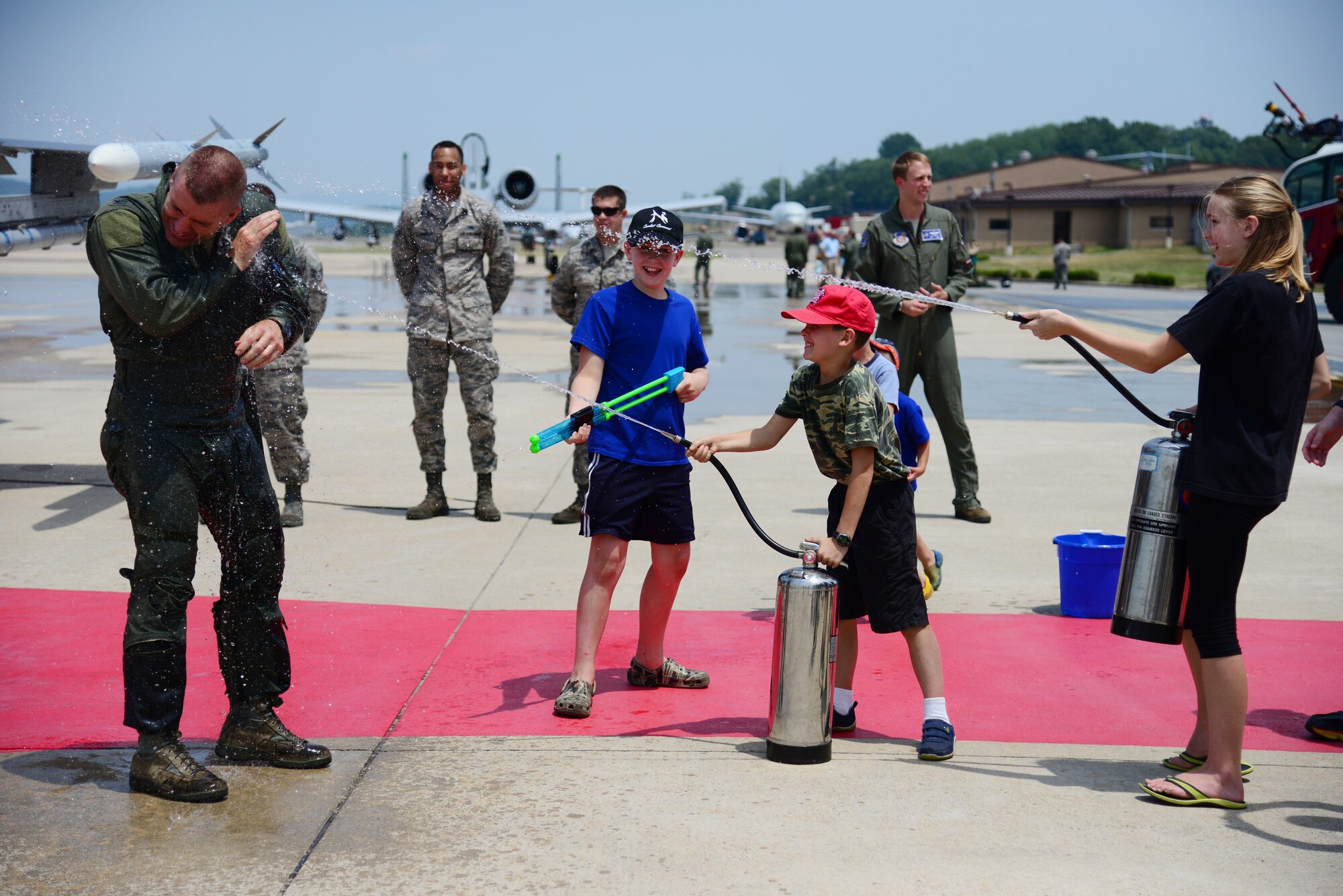 Col. Brook Leonard, 51st Fighter Wing commander, took his final flight at Osan Air Base, Republic of Korea, June 4, 2015. Leonard was gleefully soaked with the traditional water by his children.
(USAF photo by Staff Sgt. Amber Grimm)