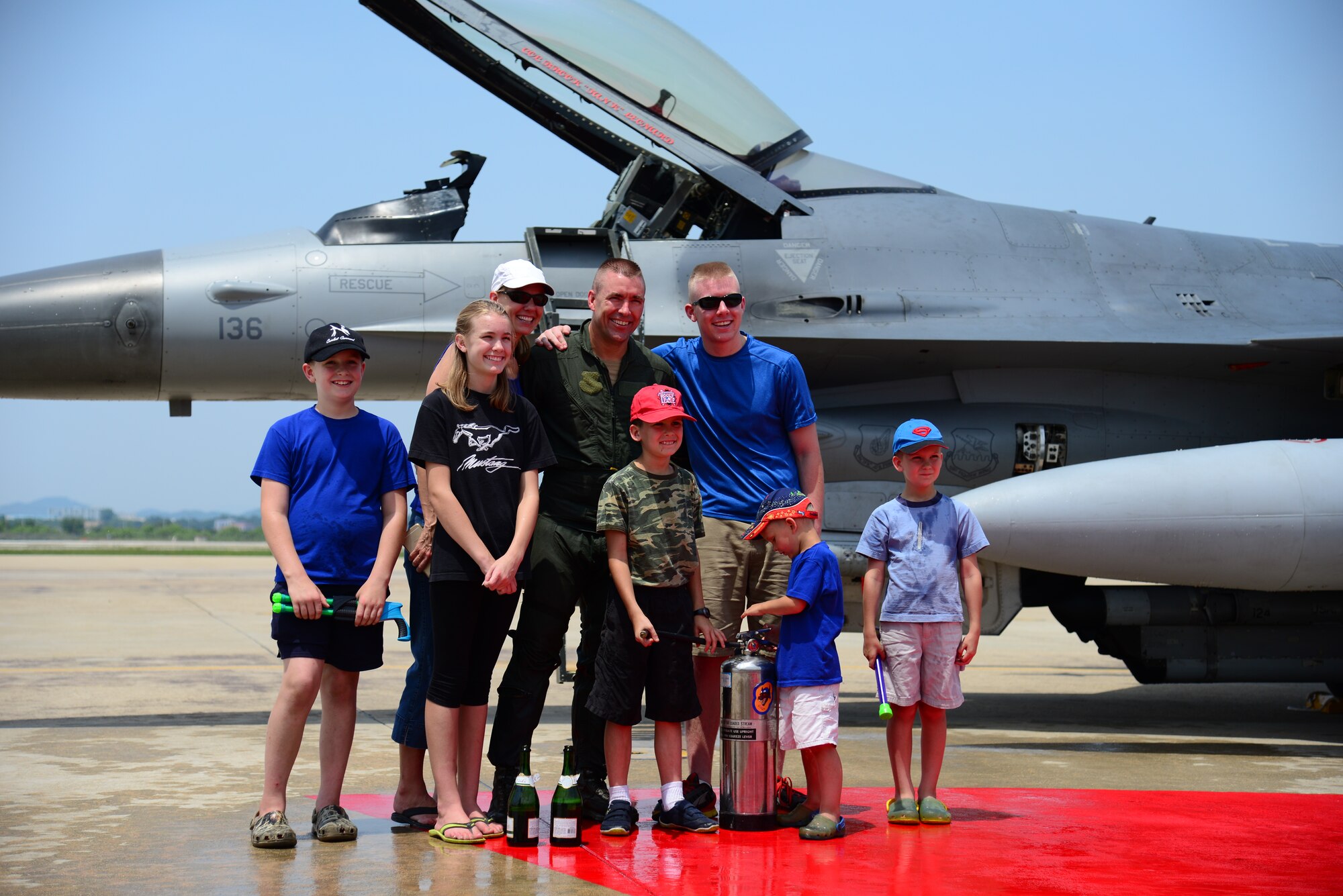 Col. Brook Leonard, 51st Fighter Wing commander, poses with his family next to his F-16 Fighting Falcon after completing his final flight at Osan Air Base, Republic of Korea, June 4, 2015. Having served as commander since July 2013, Col. Leonard will be relinquishing command to Col. Andrew Hansen in the wing change of command ceremony June 16.    
(USAF photo by Staff Sgt. Amber Grimm)