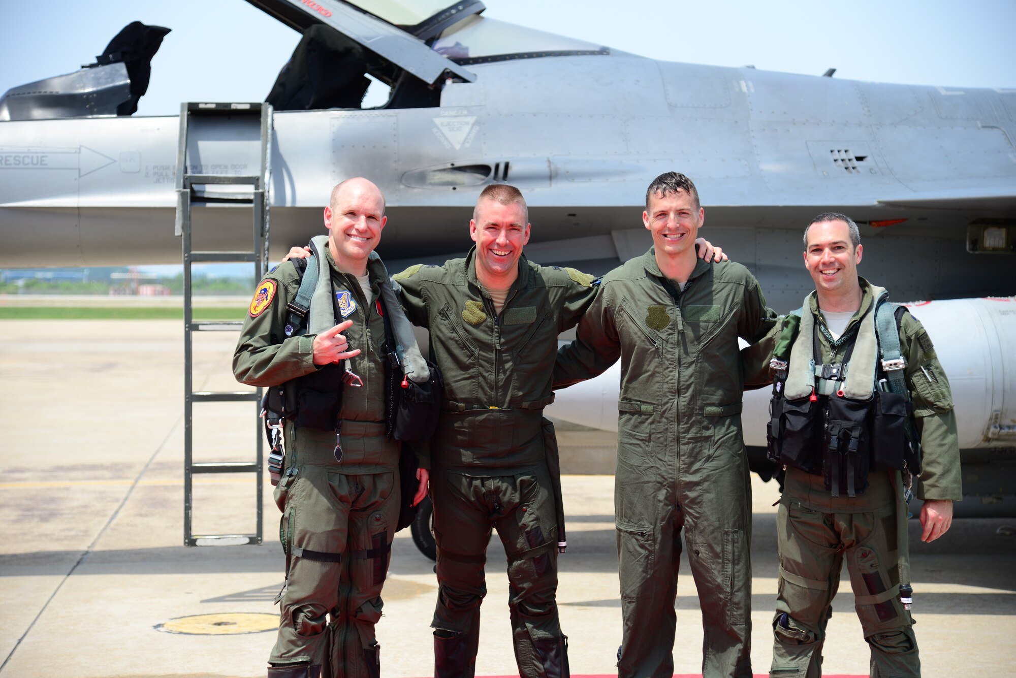Col. Brook Leonard, 51st Fighter Wing commander, poses with fellow pilots next to his F-16 Fighting Falcon after completing his final flight at Osan Air Base, Republic of Korea, June 4, 2015. Having served as commander since July 2013, Col. Leonard will be relinquishing command to Col. Andrew Hansen in the wing change of command ceremony June 16.    
(USAF photo by Staff Sgt. Amber Grimm)