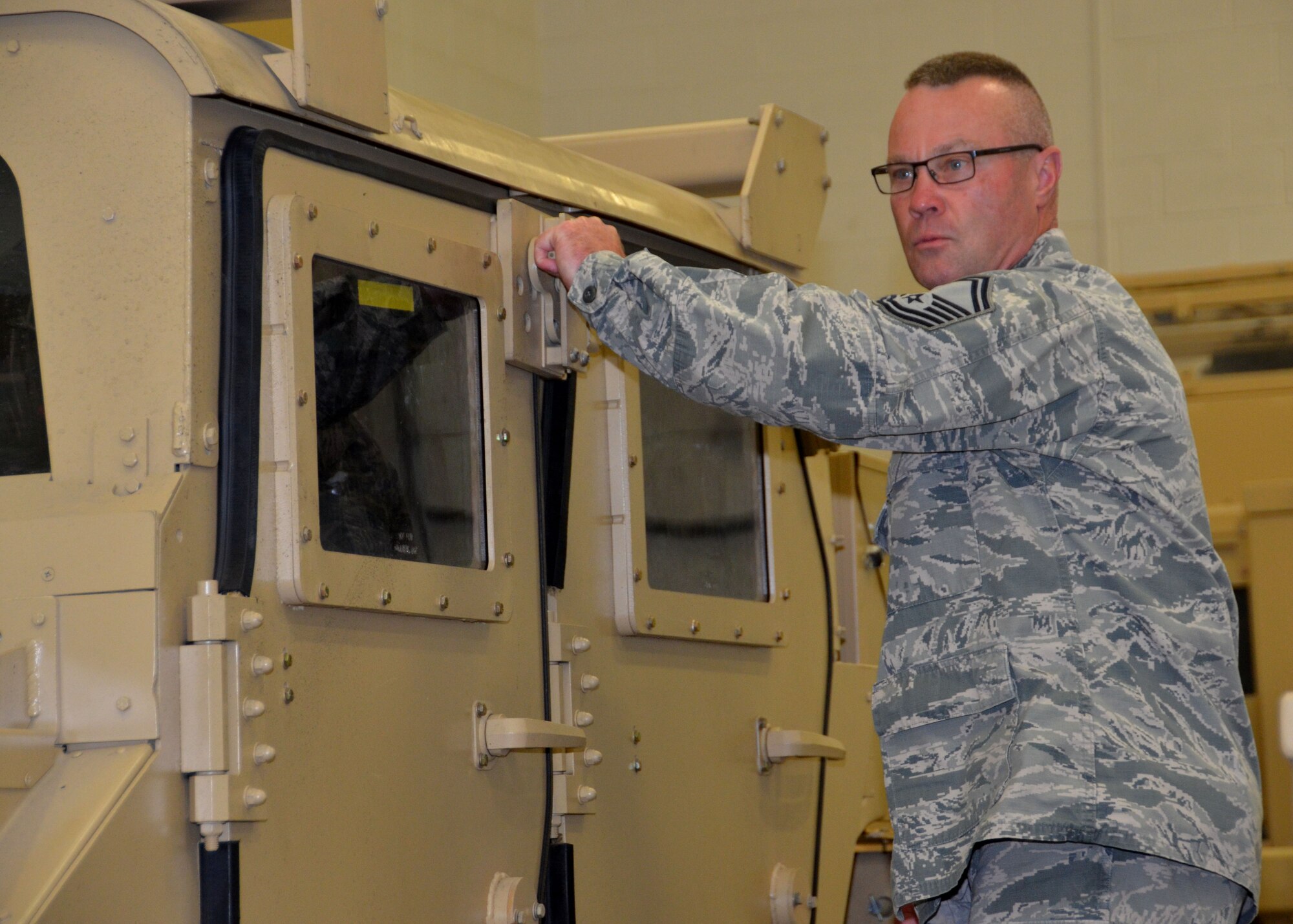 Senior Master Sgt. Ken Huff, 131st Maintenance Squadron Avionics and Accessories Flight chief, demonstrates the operation of a Humvee rollover simulator as part of state emergency response training at Camp Clark, near Nevada, Missouri, June 3, 2015.  Approximately 60 Citizen-Airmen from the Missouri Air National Guard’s 131st Bomb Wing trained for state emergency response during the week of June 2-6.
(U.S. Air National Guard photo by Tech. Sgt. Traci Payne)