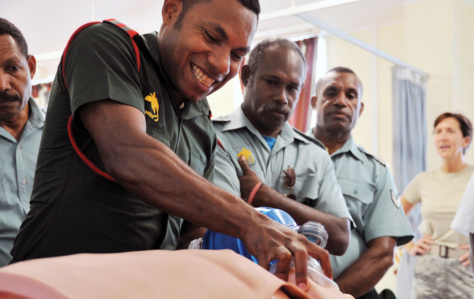 A Papua New Guinea Defence Force medic demonstrates emergency breathing tube techniques for other PNGDF medics, doctors and technicians at the Tarauma Barracks Military Hospital May 24 at Port Moresby, Papua New Guinea.  PACANGEL is a U.S. Pacific Command multilateral humanitarian assistance civil military operation, which aims to improve military-to-military partnerships in the Pacific through medical health outreach, civic engineering projects and subject matter exchanges among partner forces. (U.S. Air Force photo/1st Lt. Michael Harrington)
