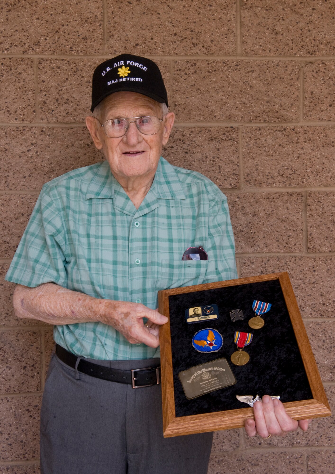 Retired U.S. Air Force Maj. Jobie Hammock poses for a photo at Nellis Air Force Base, Nev., May 21, 2015. Hammock, who joined the Army Air Corps in 1943, was stationed at the Las Vegas Army Air Field -- now Nellis AFB -- in July 1945. He recently visited Nellis AFB for the first time in 75 years. (U.S. Air Force photo by Airman 1st Class Rachel Loftis)