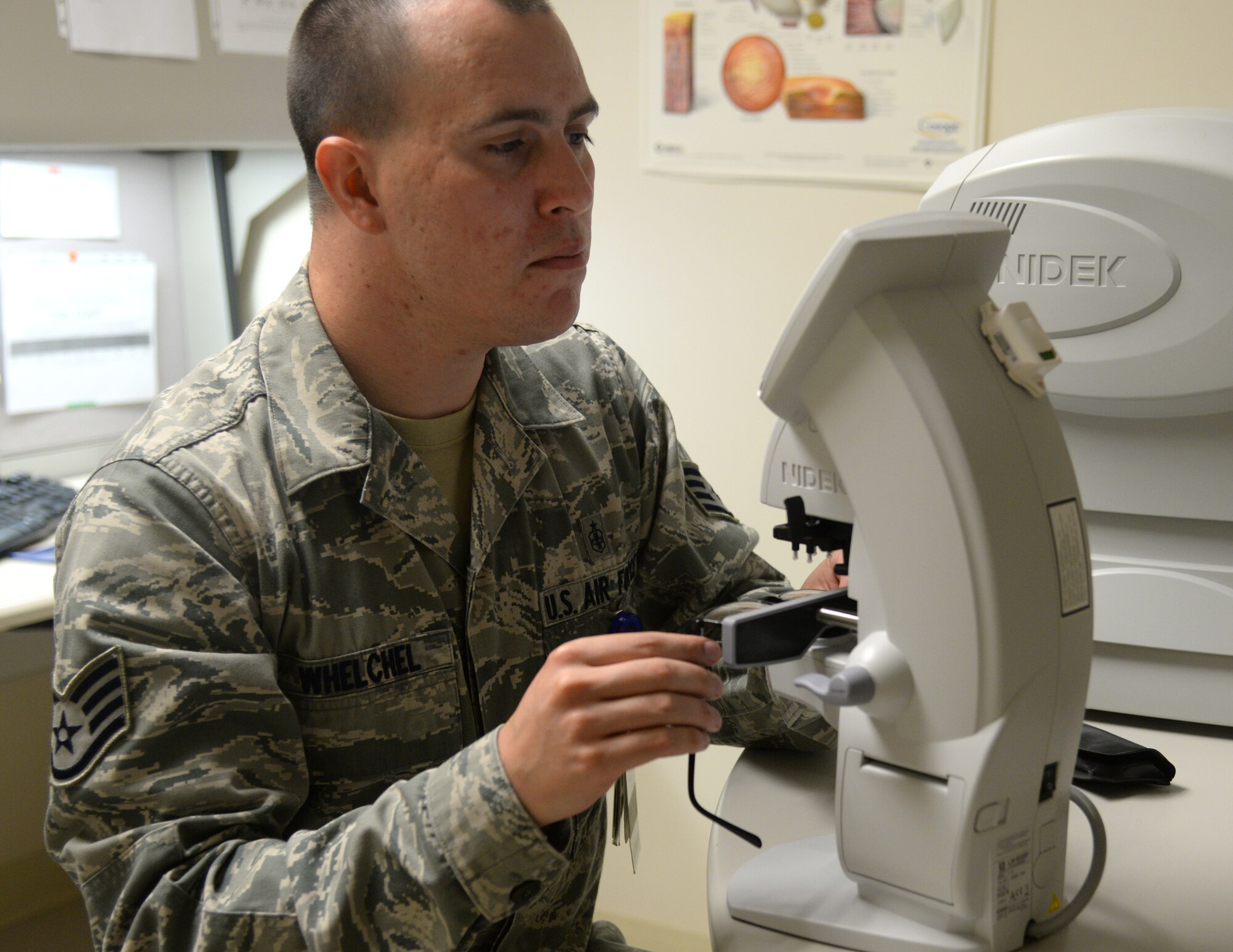 Staff Sgt. Jason Whelchel, 81st Aerospace Medicine Squadron health care manager, checks the prescription on a patient’s glasses, June 2, 2015, Keesler Air Force Base, Miss. The optometry clinic offers services such as routine eye care and fittings and repair for glasses. (U.S. Air Force photo by Senior Airman Holly Mansfield)