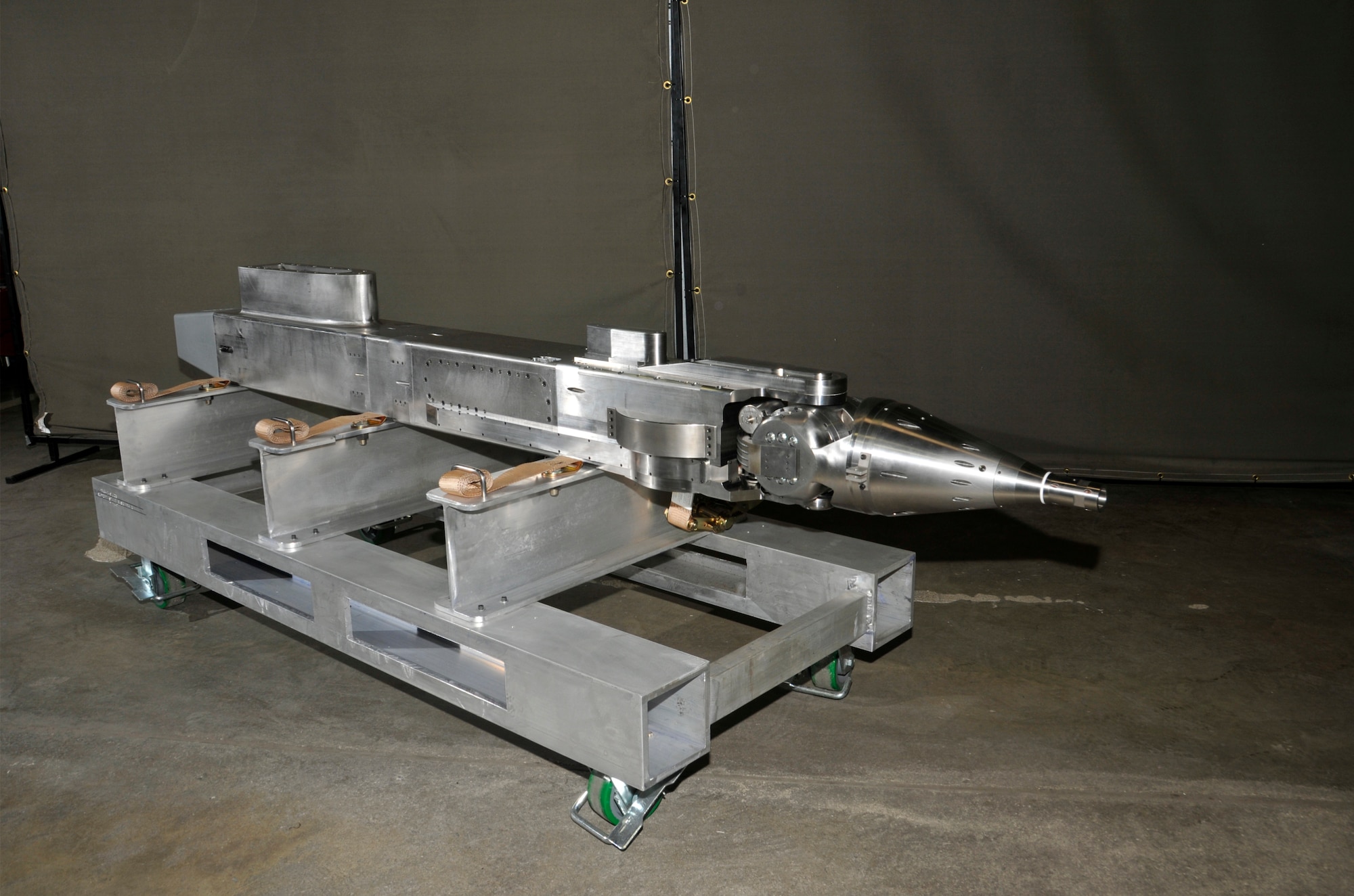 The new pitch boom mechanism for the Propulsion Wind Tunnel four-foot transonic wind tunnel (4T) Captive Trajectory Support (CTS) system is shown here after fabrication and assembly by the AEDC Model Shop. The mechanism controls the pitch, yaw and roll movement of a bomb or missile when it separates from the aircraft during a flight simulation test at altitude conditions. (Photo by Rick Goodfriend)