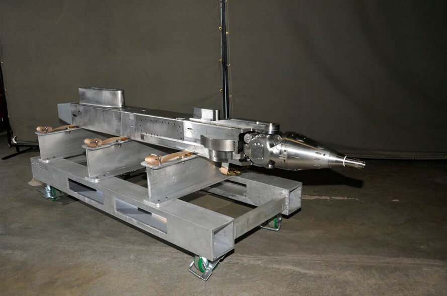 The new pitch boom mechanism for the Propulsion Wind Tunnel four-foot transonic wind tunnel (4T) Captive Trajectory Support (CTS) system is shown here after fabrication and assembly by the AEDC Model Shop. The mechanism controls the pitch, yaw and roll movement of a bomb or missile when it separates from the aircraft during a flight simulation test at altitude conditions. (Photo by Rick Goodfriend)