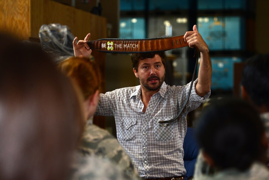 Country and western musician Ray Johnston talks about an organization called "Be The match" to Airmen on Barksdale Air Force Base, Louisiana, June 3, 2015. The organization helped Johnston find a perfect match for his bone marrow transplant which ended up saving his life. (U.S. Air Force photo/Airman 1st Class Luke Hill) 