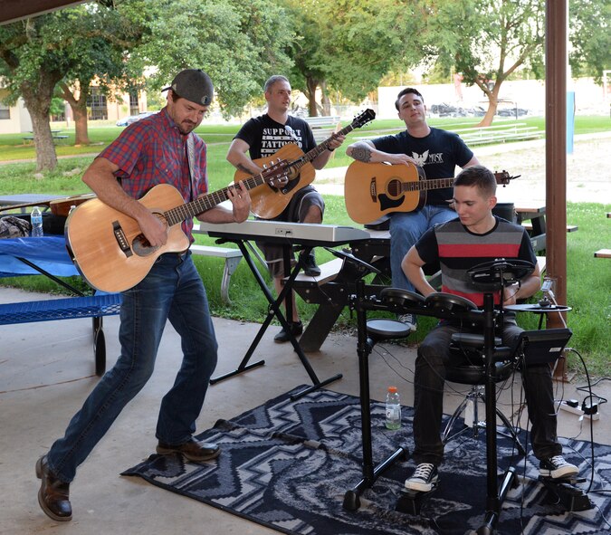 Ray Johnston, American 300 guest, plays music with Barksdale Airmen as part of a jam session on Barksdale Air Force Base, Louisiana, June 2, 2015. When his professional basketball career was cut short due to a rare form of leukemia, Johnston's passion for country music became his driving force. He says one of his biggest motivators in life is tackling challenges that have low success rates.  (U.S. Air Force photo/Airman 1st Class Curt Beach)