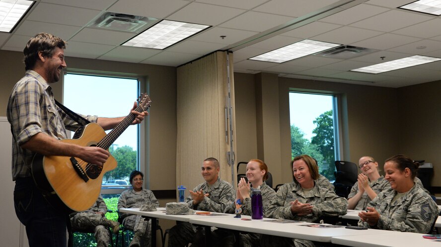 Ray Johnston, American 300 guest, plays his song "No Bad Days" for 2nd Medical Group Airmen on Barksdale Air Force Base, Louisiana, June 2, 2015. His lyrics state that as long as you're breathing, there can be no bad days, a motto he lives by every day. When his professional basketball career was cut short due to a rare form of leukemia, Johnston's passion for country music became his driving force. Johnston says one of his biggest motivators in life is tackling challenges that have low success rates. (U.S. Air Force photo/Airman 1st Class Curt Beach)