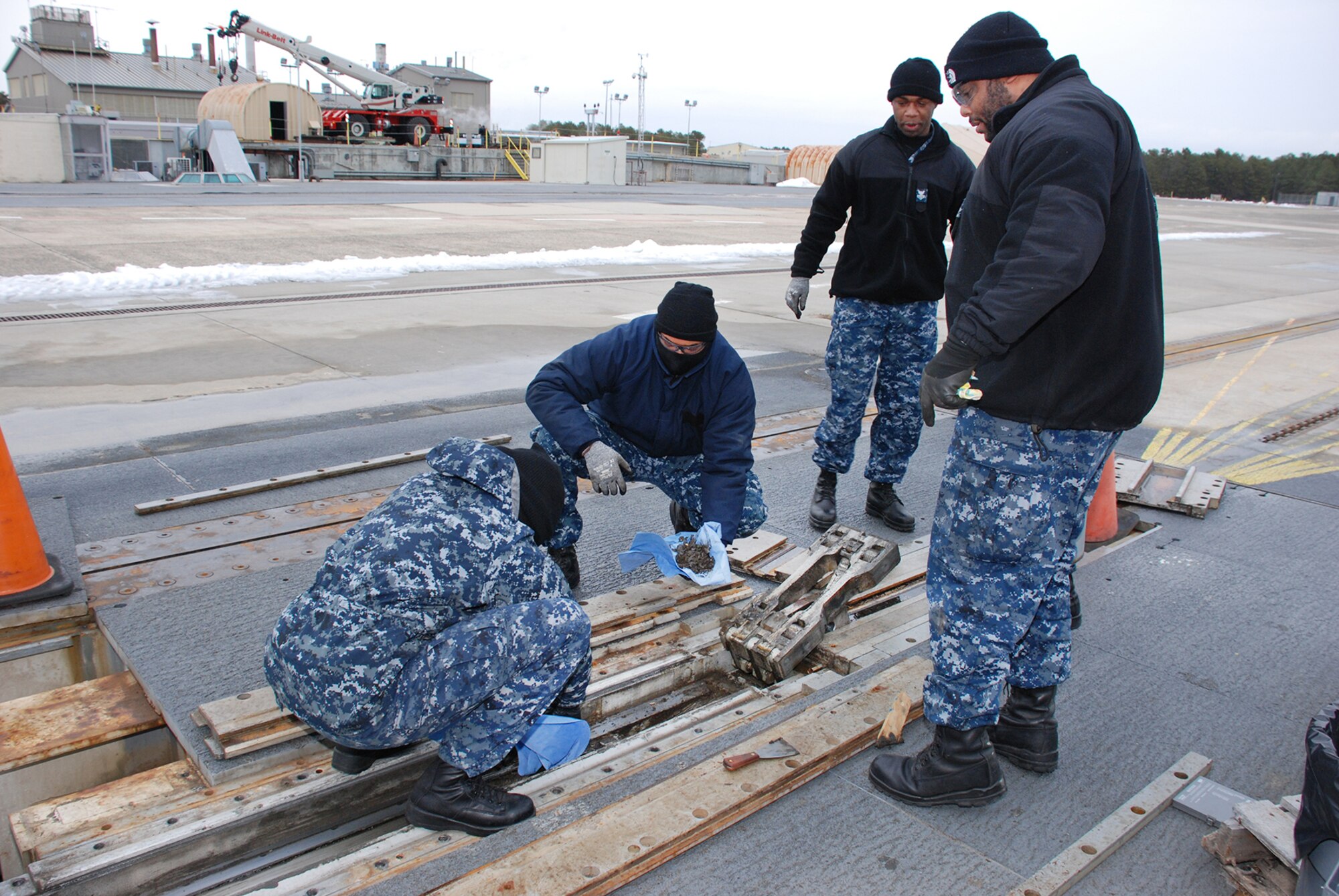 Sailors from Gerald R. Ford (CVN 78) Pre-Commissioning Unit engage in a hands-on Electromagnetic Aircraft Launch System maintenance training exercise at the land-based test site at Joint Base McGuire-Dix-Lakehurst, N.J., Feb. 5, 2015. (U.S. Navy Photo/Released)