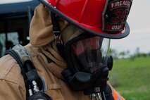 A member of the 5th Civil Engineer Squadron puts on his hazardous material equipment for an exercise at Minot Air Force Base, N.D., May 29, 2015. The exercise was held to ensure first responders and base personnel are properly trained to clean up and decontaminate a simulated hazardous material situation. (U.S. Air Force photo/Airman 1st Class Christian Sullivan)