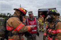 Members of the 5th Civil Engineer Squadron prepare to take place in Exercise Prairie Rampart 15-2 at Minot Air Force Base, N.D., May 29, 2015. The exercise was held to ensure first responders and base personnel are properly trained to clean up and decontaminate a simulated hazardous material situation. (U.S. Air Force photo/Airman 1st Class Christian Sullivan)