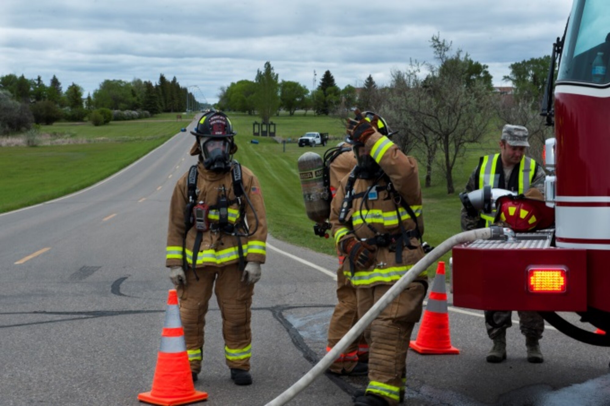 Members of the 5th Civil Engineer Squadron suit up in preparation for Exercise Prairie 
Rampart 15-2 at Minot Air Force Base, N.D., May 29, 2015. The exercise was held to ensure first responders and base personnel can respond and are properly trained to clean up and decontaminate a hazardous material situation. (U.S. Air Force photo/Airman 1st Class Christian Sullivan)