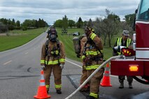 Members of the 5th Civil Engineer Squadron suit up in preparation for Exercise Prairie 
Rampart 15-2 at Minot Air Force Base, N.D., May 29, 2015. The exercise was held to ensure first responders and base personnel can respond and are properly trained to clean up and decontaminate a hazardous material situation. (U.S. Air Force photo/Airman 1st Class Christian Sullivan)