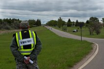 An evaluator during Exercise Prairie Rampart 15-2 waits for members of the 5th Civil Engineer Squadron to respond to a simulated hazardous material spill at Minot Air Force Base, N.D., May 29, 2015. Personnel train year-round to be prepared for real-life situations. (U.S. Air Force photo/Airman 1st Class Christian Sullivan)
