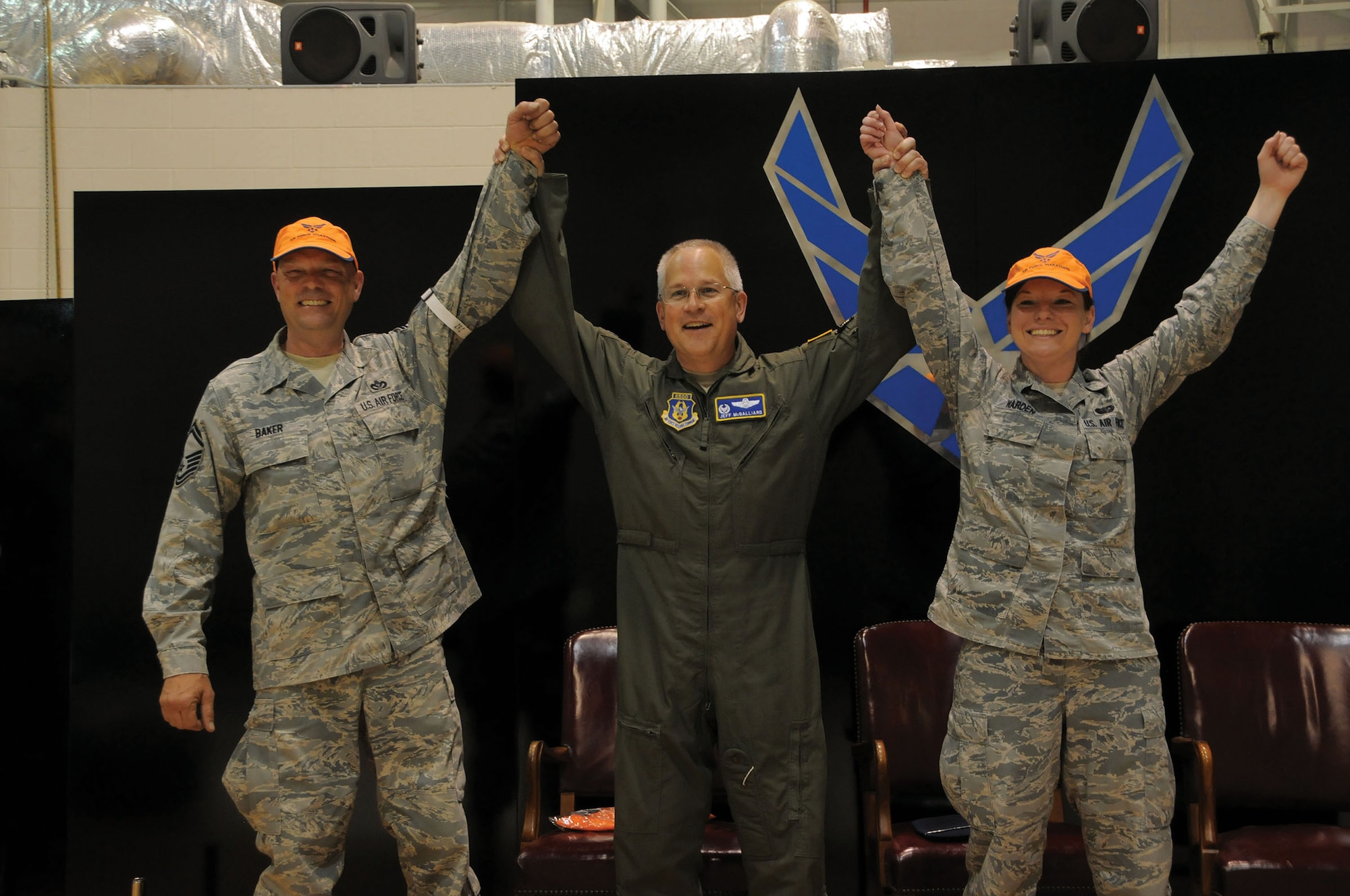 WRIGHT-PATTERSON AIR FORCE BASE, Ohio – Col. Jeffrey McGalliard, 445th Airlift Wing commander, congratulates Senior Master Sgt. Al Baker, 445th Civil Engineer Squadron, and Staff Sgt. Clare Warden, 445th Force Support Squadron, for winning the “MOPP Off” contest May 3, 2015. (U.S. Air Force photo/Tech. Sgt. Anthony Springer) 
