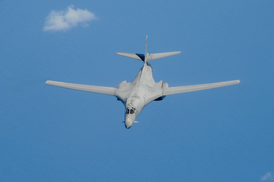 A U.S. Air Force B-1B Lancer bomber belonging to Dyess Air Force Base,
Texas, flies through the sky after refueling during a training sortie
involving aircraft from Dyess and Kadena Air Base, Japan, May 8, 2015. B-1s
recently conducted test and training missions in the Asia-Pacific region to
validate the modified jet's long-range strike capability and to further
develop maritime tactics, techniques and procedures for the airframe. (Courtesy Photo)
