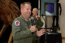Maj. Sean Cross (left), 53rd Weather Reconnaissance Squadron "Hurricane Hunters" instructor pilot, and Lt. Col. Jon Talbot, 53rd WRS chief meteorologist, talk to attendees at the Katrina +10 event held May 31, 2015, in the Ohr-O'Keefe Museum of Art in Biloxi, Mississippi. The event was designed to examine the destruction, relief efforts and recovery associated with Hurricane Katrina, which made landfall August 29, 2005, nearly 10 years ago. (U.S. Air Force photo/Tech. Sgt. Ryan Labadens)