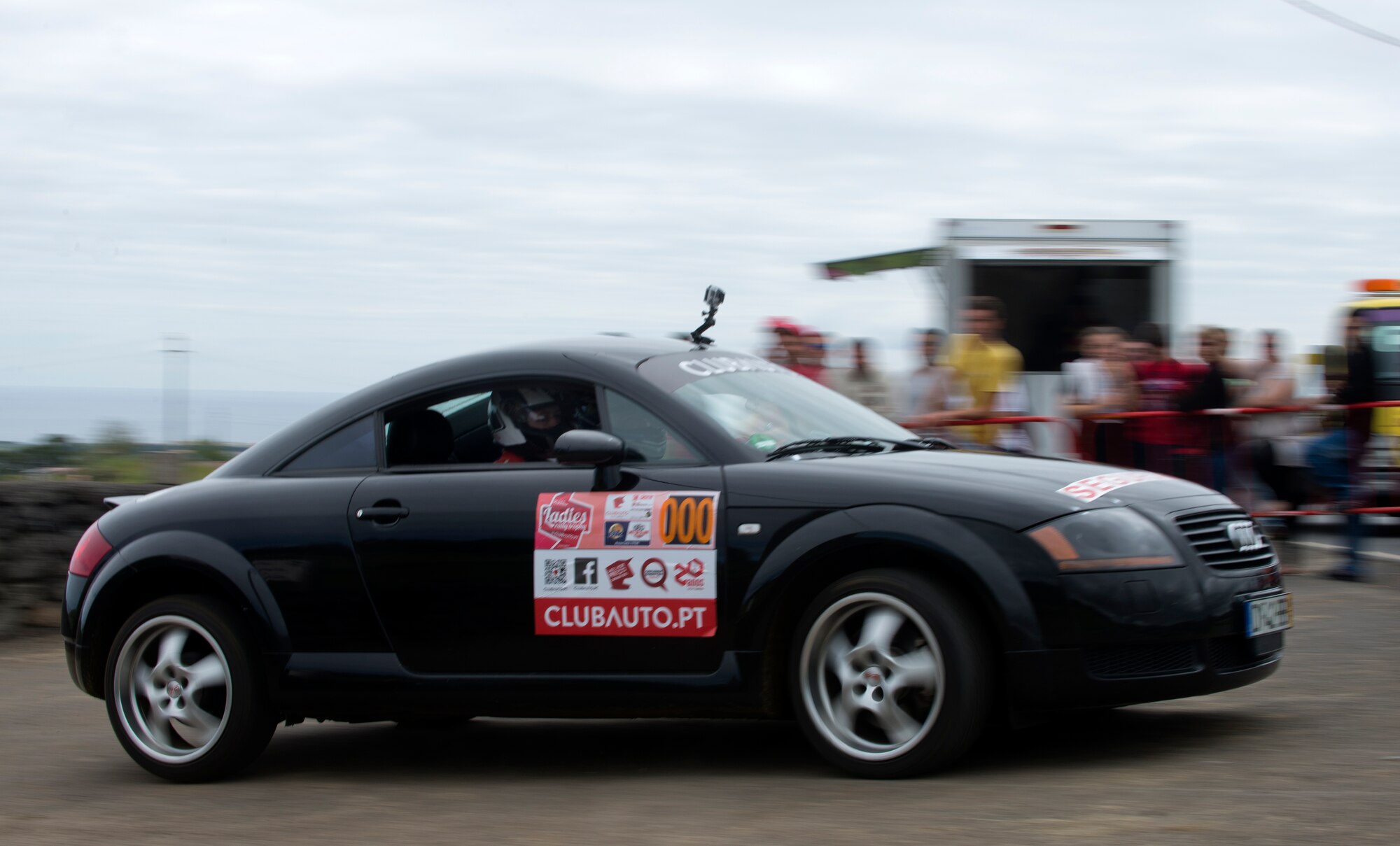 Melissa Goodnight, 65th Civil Engineer Squadron operations administrator, and Senior Airman Alanna Britton, 65th Air Base Wing general law paralegal, take a turn during Stage Two of the Ladies Rally race in Vila Nova, Azores, Portugal, May 30, 2015. Britton drove the triple zero car that is designated as the safety vehicle to ensure all potential hazards on the course are reported back to racers. (U.S. Air Force photo/Tech. Sgt. Zachary Wolf)(Released)