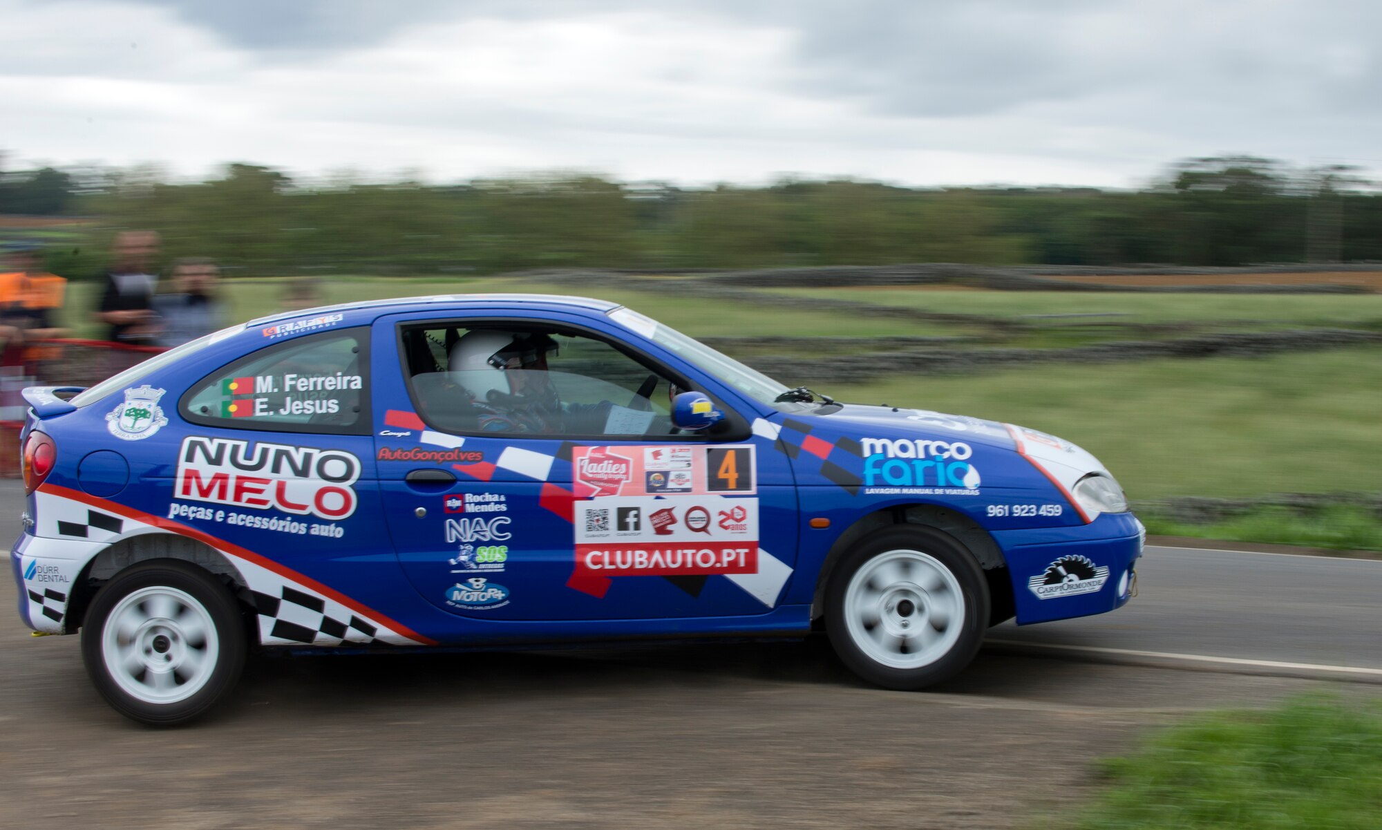 Participants driving the number four car take a turn at the Ladies Rally race in Vila Nova, Azores, Portugal, May 30, 2015. The racers would run one lap, or stage and try to score the fastest time. (U.S. Air Force photo/Tech. Sgt. Zachary Wolf)(Released)