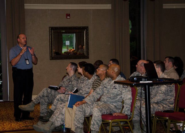 William Scheer, 628th Security Forces Squadron Weapons Station Operations manager, talks to the audience during the Quality of Life Council Meeting, June 3, 2015 at Joint Base Charleston – Weapons Station, S.C. The purpose of the  meeting was to solicit input from base personnel to identify problems and to improve base services. (U.S. Air Force photo/Staff Sgt. AJ Hyatt)
