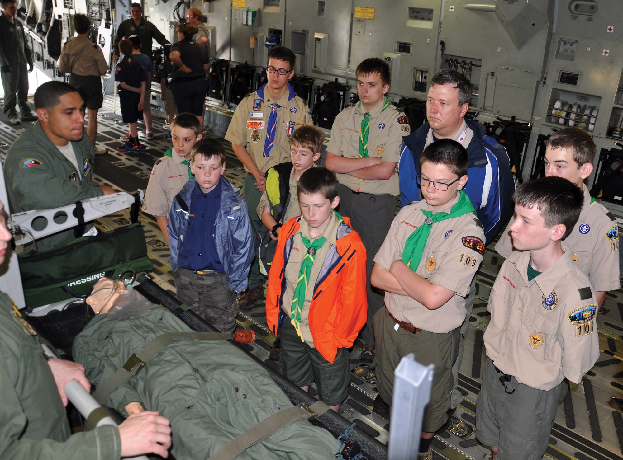 WRIGHT-PATTERSON AIR FORCE BASE, Ohio – Boy Scouts watch a demonstration by the 445th Aeromedical Evacuation Squadron onboard a C-17 Globemaster III during the 445th Airlift Wing Scouts Day event May 16, 2015. More than 150 Scouts signed up to attend the event. Scouts from across Ohio and Kentucky had the opportunity to not only visit with Airmen from AES, they also toured the C-17, participated in demonstrations by the 445th Security Forces Squadron and visited with firefighters from the wing while touring a fire truck. (U.S. Air Force photo/Maj. Demetrius Smith)