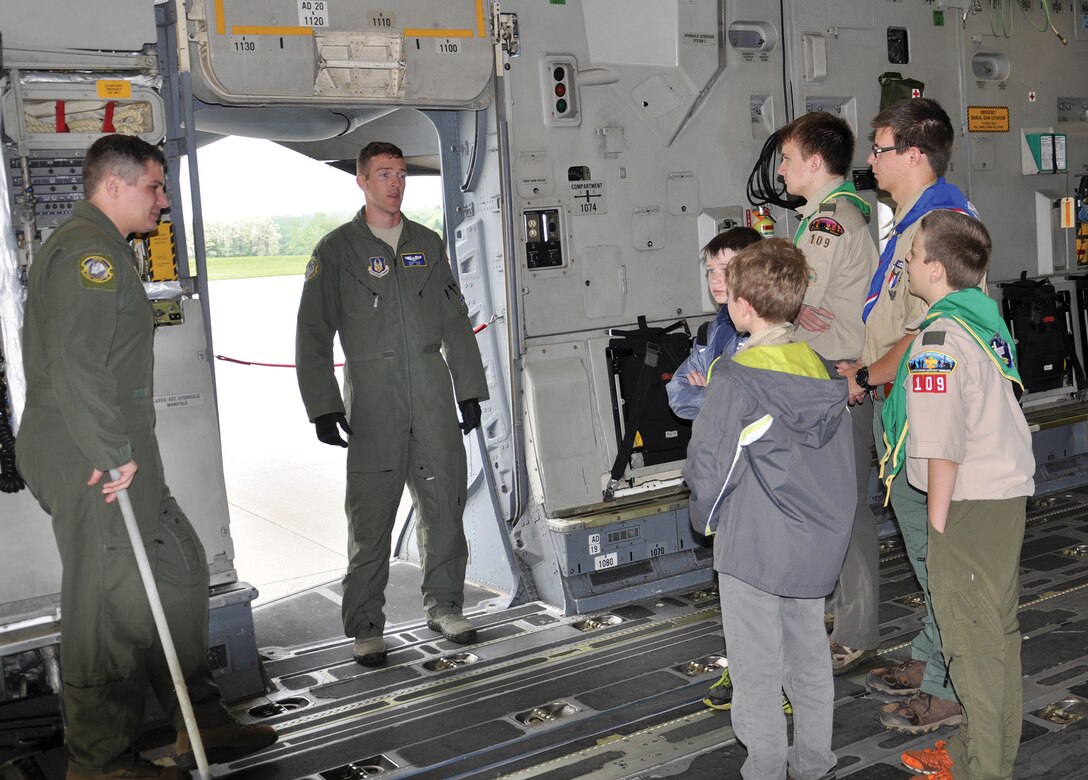 WRIGHT-PATTERSON AIR FORCE BASE, Ohio – Staff Sgts. Justin Bateman and Trevor Dixon, 89th Airlift Squadron loadmasters, show a group of Scouts the cargo area of a C-17 Globemaster III during the 445th Airlift Wing Scouts Day event May 16, 2015. More than 150 Scouts signed up to attend the event. Scouts from across Ohio and Kentucky had the opportunity to not only tour a C-17 Globemaster III, they also participated in demonstrations by the 445th Aeromedical Evacuation Squadron and 445th Security Forces Squadron plus they visited with firefighters from the wing while touring a fire truck. (U.S. Air Force photo/Maj. Demetrius Smith)