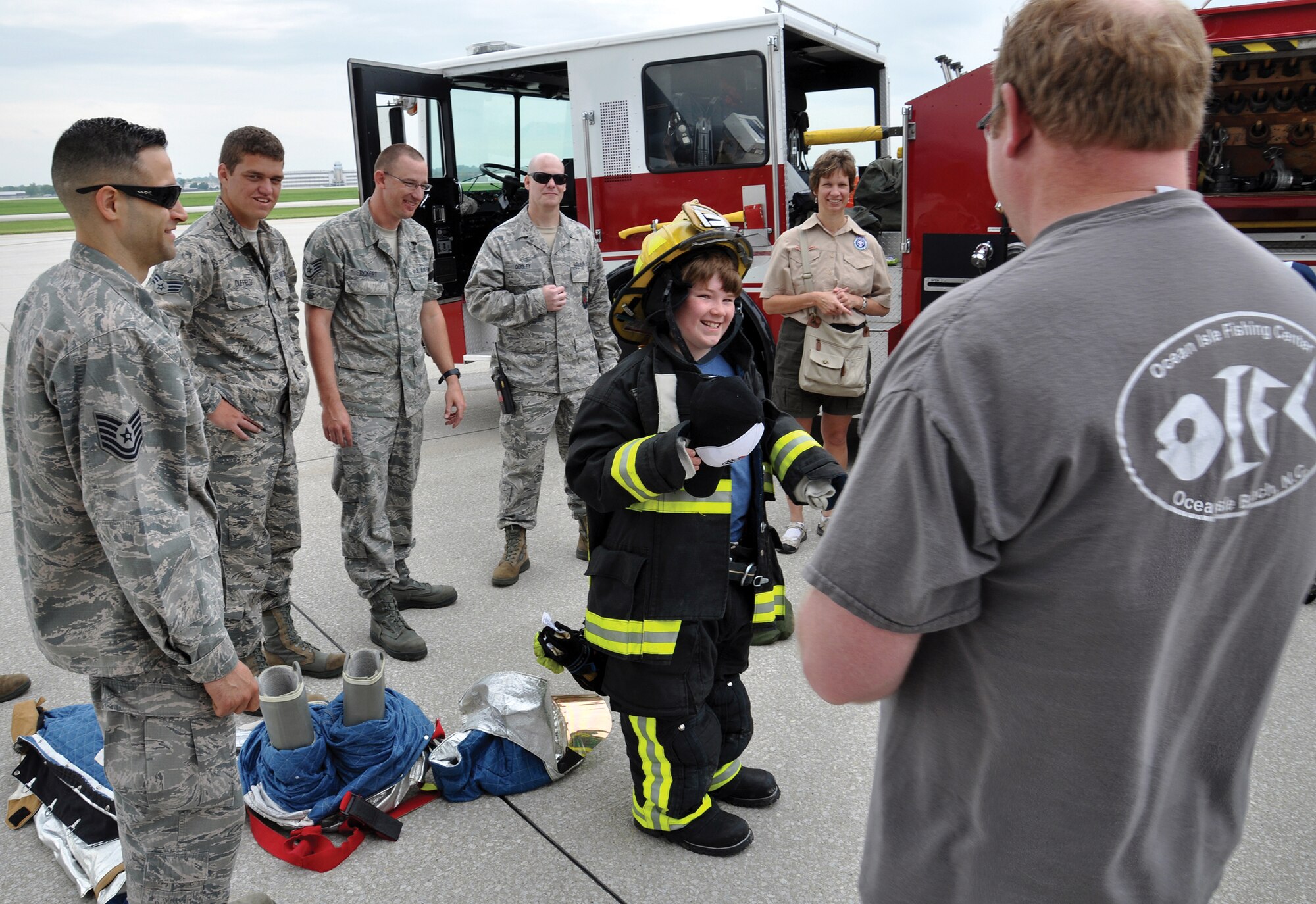 WRIGHT-PATTERSON AIR FORCE BASE, Ohio – A Scout tries on firefighter gear during the 445th Airlift Wing’s annual Scouts Day event May 16, 2015. More than 150 Scouts signed up to attend the event. Scouts from across Ohio and Kentucky had the opportunity to not only visit with firefighters from the wing, they also toured a C-17 Globemaster III, participated in demonstrations by the 445th Aeromedical Evacuation Squadron and 445th Security Forces Squadron. (U.S. Air Force photo/Maj. Demetrius Smith)