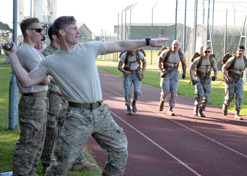 Members from the 100th Security Forces Squadron and the 48th Security Forces Squadron take part in a “Defender Challenge” May 21, 2015, on RAF Mildenhall, England. Participants performed various challenges to test their mental and physical stamina while honoring those who served before them. (U.S. Air Force photo by Gina Randall/Released)