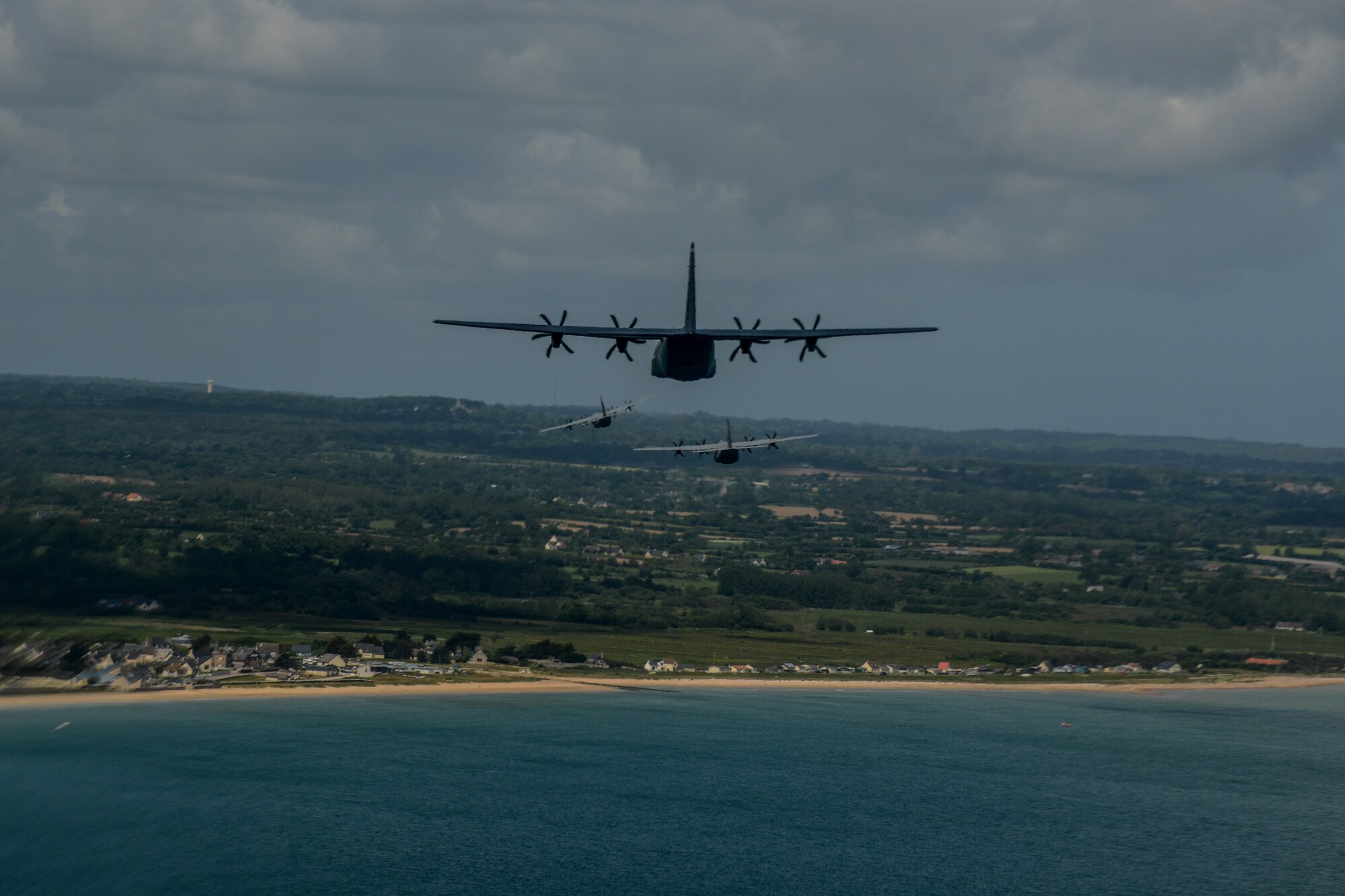 Three U.S. Air Force C-130J Super Hercules from the 37th Airlift Squadron fly over the coast of Normandy, France, June 3, 2015. More than 380 service members from Europe and affiliated D-Day historical units are participating in the 71st anniversary as part of Joint Task Force D-Day 71. The task force, based in Saint Mere Eglise, France, is supporting local events across Normandy, from June 2-8, 2015, to commemorate the selfless actions by all the Allies on D-Day that continue to resonate 71 years later. (U.S. Air Force photo/Senior Airman Nicole Sikorski)