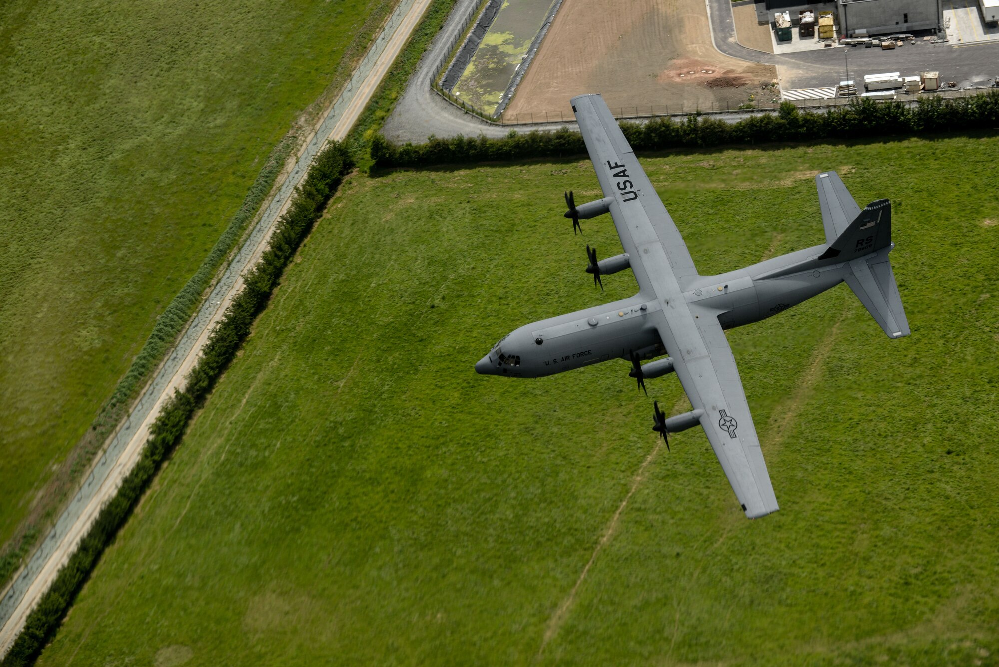An U.S. Air Force C-130J Super Hercules from the 37th Airlift Squadron, flies over Normandy, France, June 3, 2015. More than 380 service members from Europe and affiliated D-Day historical units are participating in the 71st anniversary as part of Joint Task Force D-Day 71. The task force, based in Saint Mere Eglise, France, is supporting local events across Normandy, from June 2-8, 2015, to commemorate the selfless actions by all the Allies on D-Day that continue to resonate 71 years later. (U.S. Air Force photo/Senior Airman Nicole Sikorski)