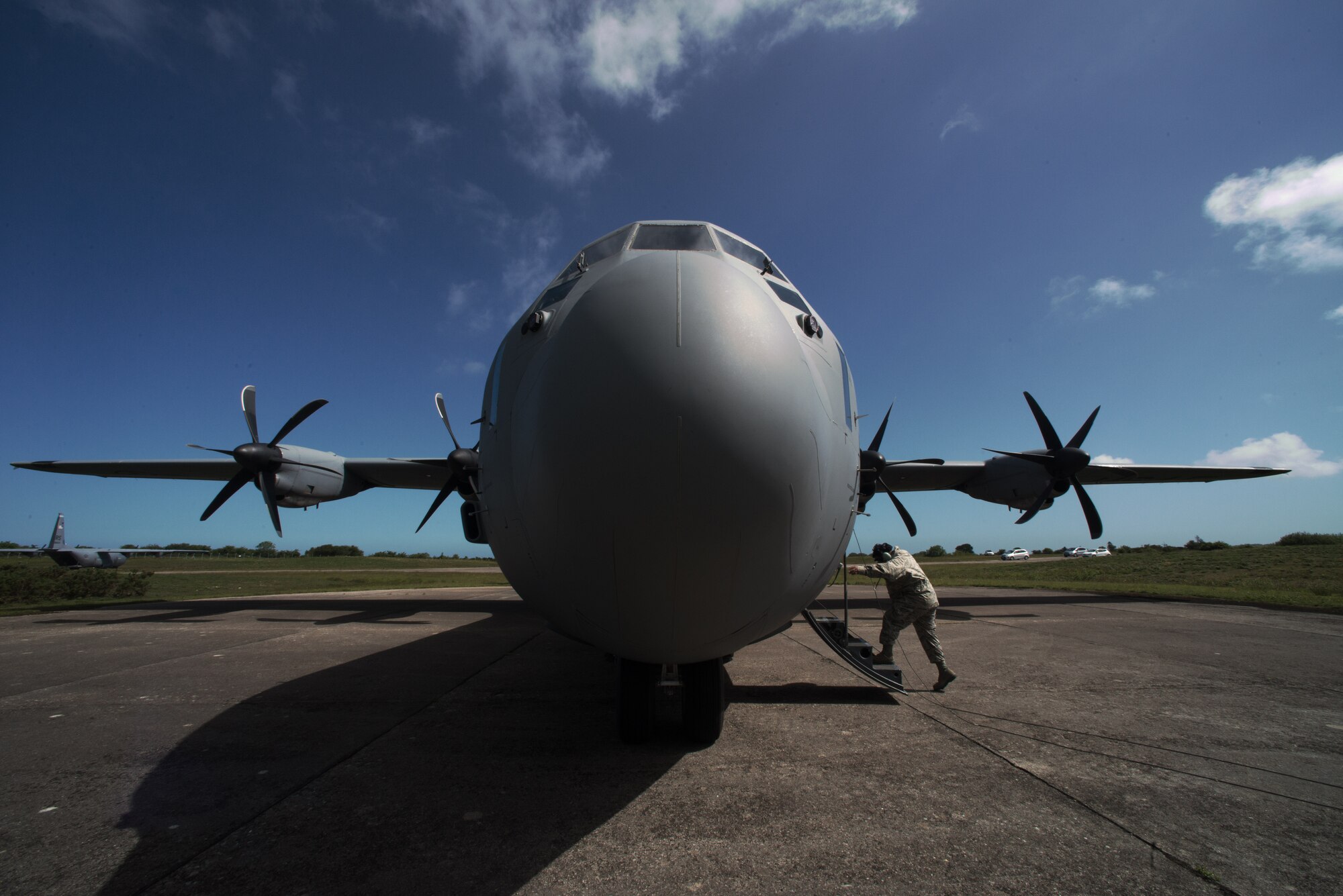 U.S. Air Force Staff Sgt. Eric McNeil, 86th Aircraft Maintenance Squadron engine mechanic, enters a C-130J Super Hercules June 3, 2015, in Normandy, France. More than 380 service members from Europe and affiliated D-Day historical units are participating in the 71st anniversary as part of Joint Task Force D-Day 71. The task force, based in Saint Mere Eglise, France, is supporting local events across Normandy, from June 2-8, 2015, to commemorate the selfless actions by all the Allies on D-Day that continue to resonate 71 years later. (U.S. Air Force photo/Senior Airman Nicole Sikorski)
