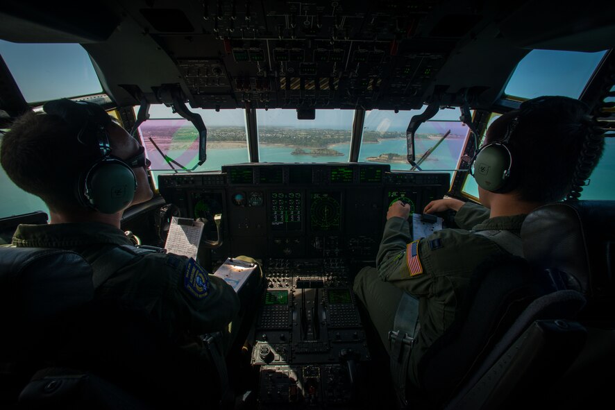 U.S. Air Force Capts. Lindsey Kinsinger and Chad Thompson, both pilots assigned to the 37th Airlift Squadron, fly over the coast of Normandy, France, June 3, 2015. More than 380 service members from Europe and affiliated D-Day historical units are participating in the 71st anniversary as part of Joint Task Force D-Day 71. The task force, based in Saint Mere Eglise, France, is supporting local events across Normandy, from June 2-8, 2015, to commemorate the selfless actions by all the Allies on D-Day that continue to resonate 71 years later. (U.S. Air Force photo/Senior Airman Nicole Sikorski)