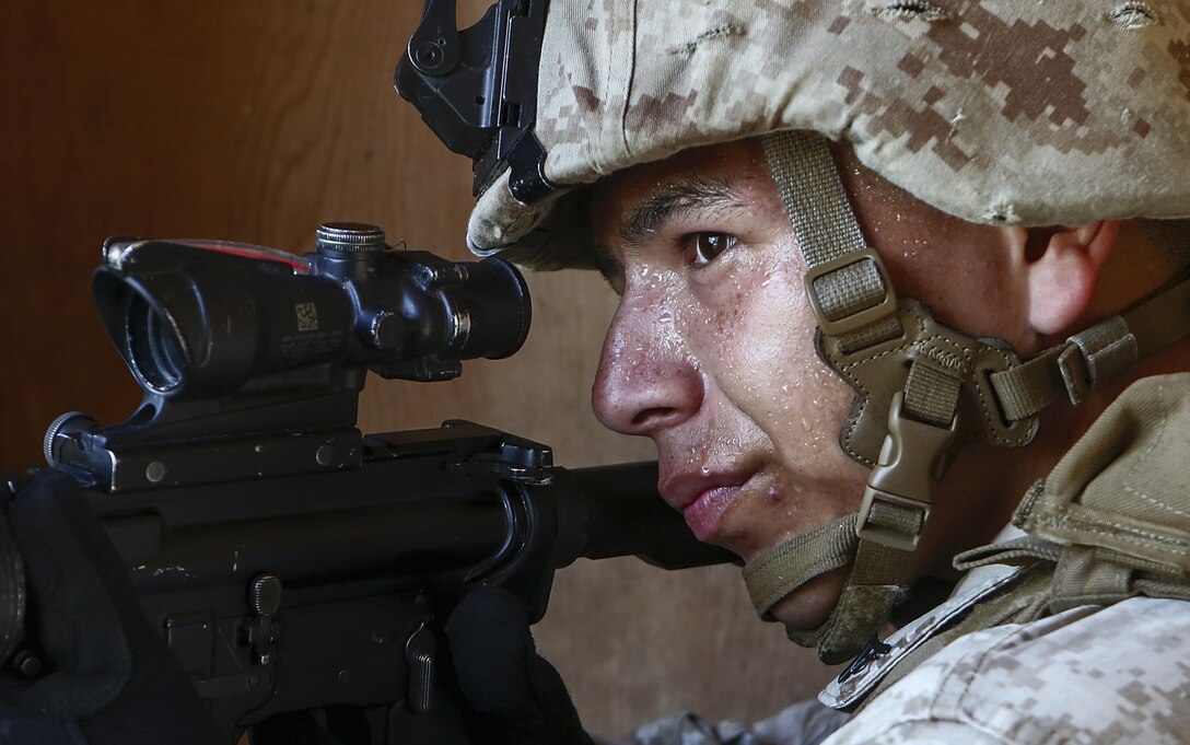 Marines with Company E, Battalion Landing Team 2/6 conduct military operations in urban terrain (MOUT) training at Mobile MOUT aboard Marine Corps Base Camp Lejeune, N.C., May 28, 2015. During the training, the Marines practiced patrolling, established vehicle checkpoints, and conducted  assault drills during day and night operations. (Photo by Staff Sgt. Bobby J. Yarbrough)