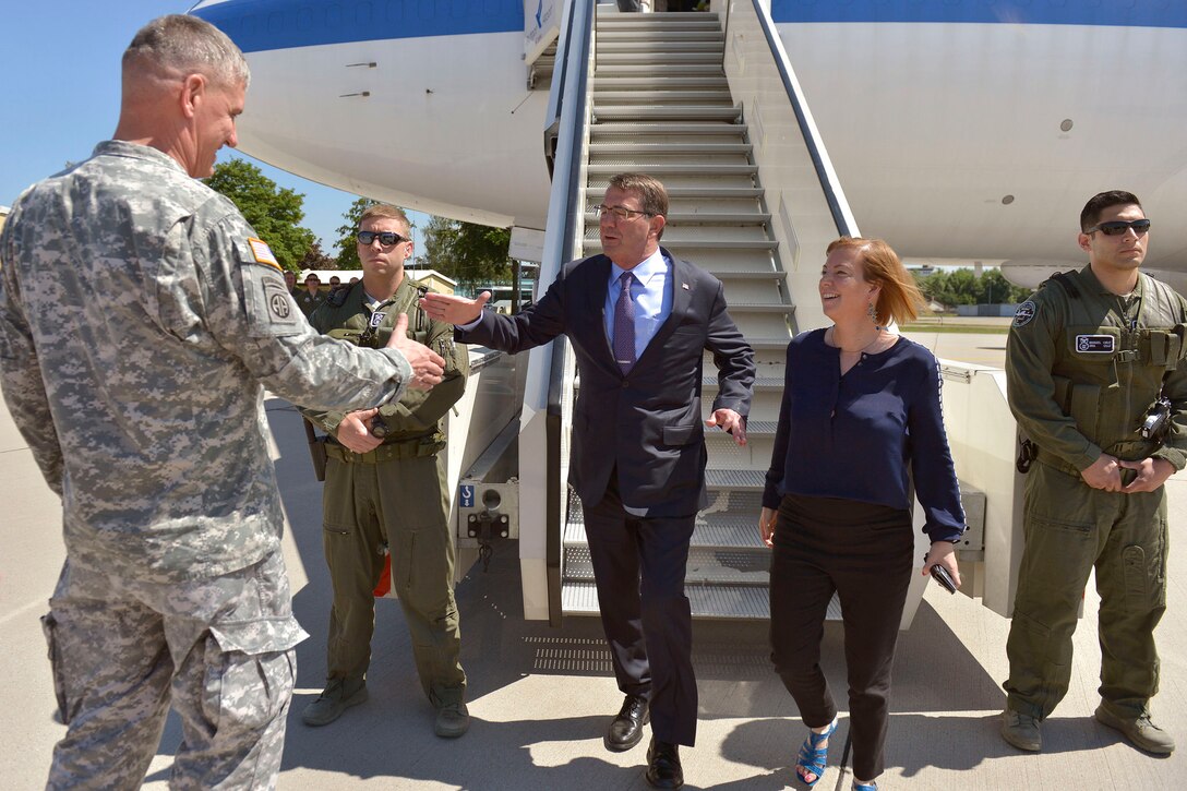 U.S. Army Gen. David M. Rodriguez, commander of U.S. Africa Command, greets U.S. Defense Secretary Ash Carter, left, and his wife, Stephanie, as they arrive in Stuttgart, Germany, June 4, 2015, where Carter hosted a troop talk with U.S. service members. Carter is wrapping up a trip that also took him to the Asia-Pacific region where he met with allies and partners to advance the next phase of the rebalance.