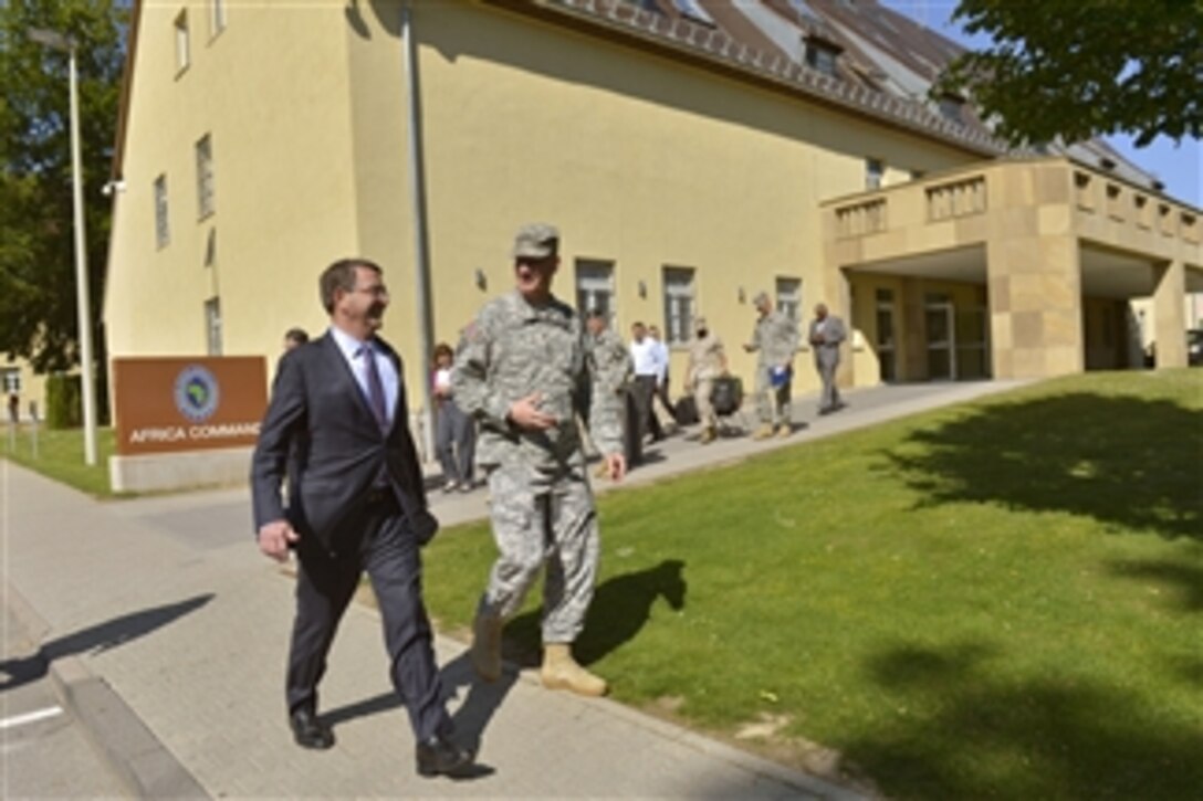U.S. Defense Secretary Ash Carter walks with U.S. Army Gen. David M. Rodriguez, commander of U.S. Africa Command, to a troop event at the command's headquarters in Stuttgart, Germany, June 4, 2015. 