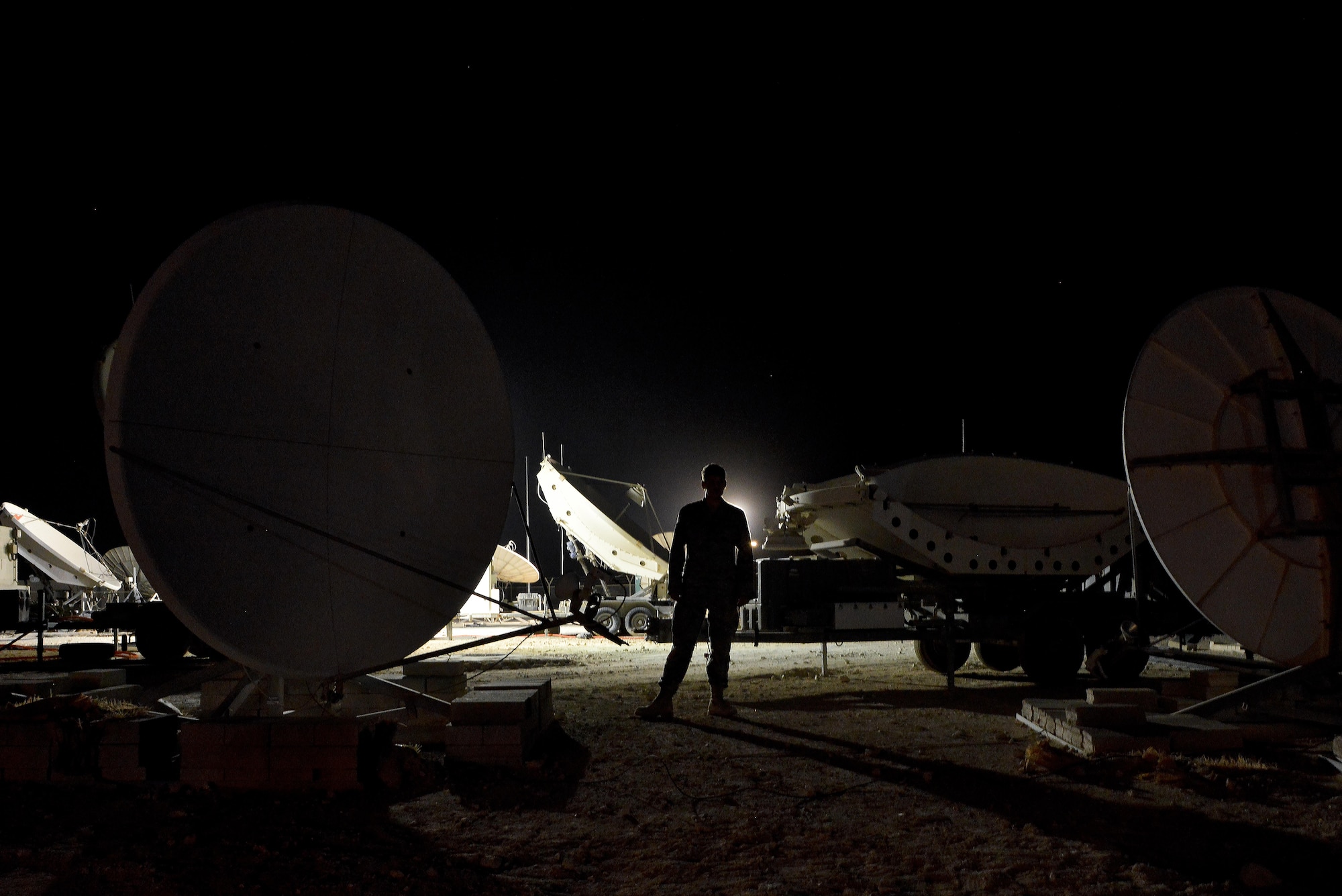 Senior Airman Casey Jones, an airman assigned to the 379th Expeditionary Operations Support Squadron Silent Sentry, is an operator for the Rapid Attack Identification Detection Reporting System Deployable Ground Segment, for which he routinely completes maintenance checks to ensure accuracy of signal strength and functionality. The Silent Sentry team monitors high priority satellite communication signals, detects electromagnetic interference on those signals and geolocates the source of that interference along with other signals of interest. (U.S. Air Force photo/Staff Sgt. Alexandre Montes)