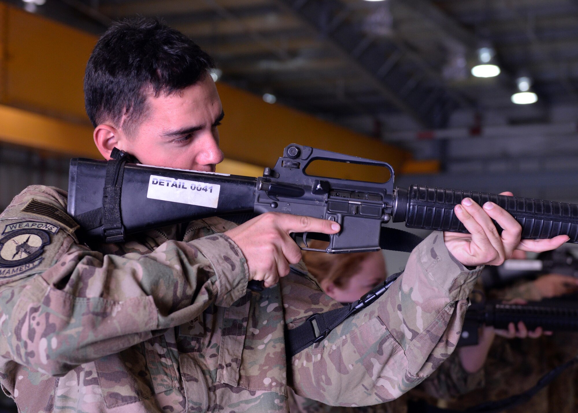 U.S. Air Force Senior Airman Christopher Webb, 455th Expeditionary Maintenance Squadron aircraft fuels journeyman, focuses on a target during Check 6 training May 25, 2015, at Bagram Air Field, Afghanistan. During training, Airmen are briefed on the threat levels and possible hostile situations that could occur at BAF, followed by hands-on weapons retention training. (U.S. Air Force photo by Senior Airman Cierra Presentado/Released)