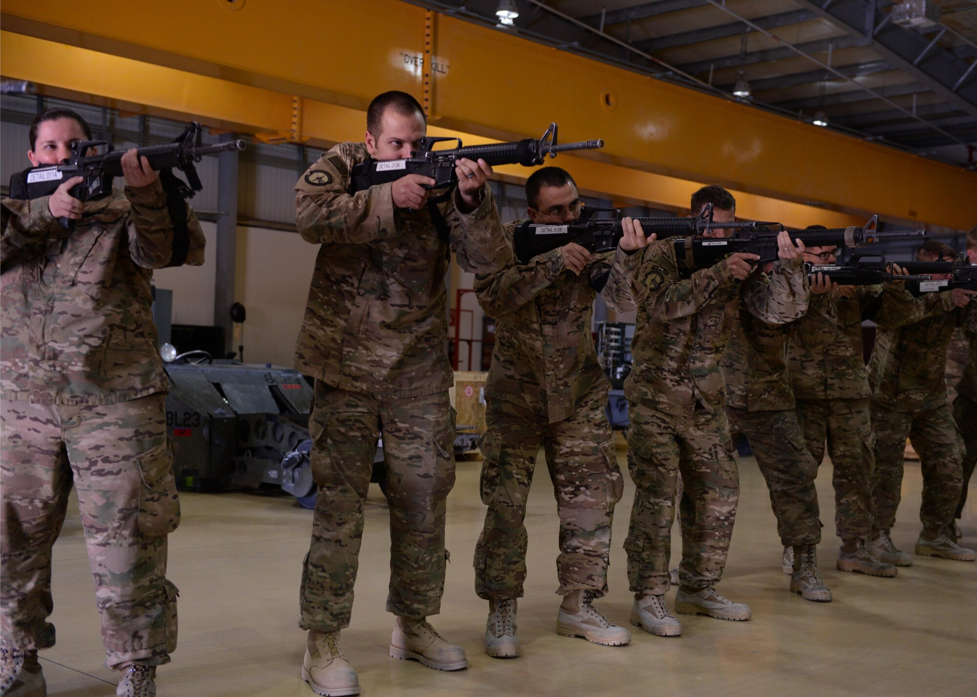U.S. Airmen from the 455th Expeditionary Maintenance Squadron practice weapons retention during Check 6 training May 25, 2015, at Bagram Air Field, Afghanistan. Check 6 is an active shooter/insider threat awareness program that teaches Airmen how to react and respond with their weapons in the event that a hostile situation occurs at the base. (U.S. Air Force photo by Senior Airman Cierra Presentado/Released)