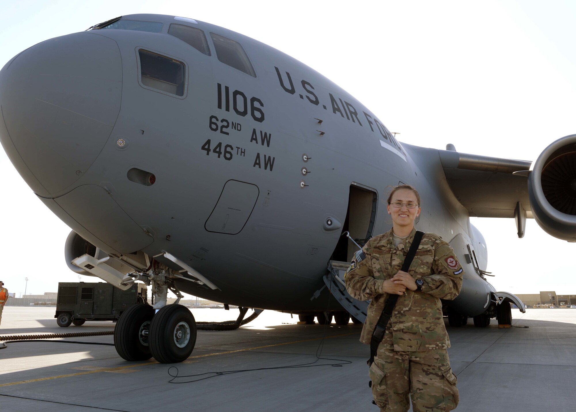U.S. Air Force Senior Airman Aigerim Akhmetova, Expeditionary Air Mobility Squadron C-17 supply clerk, poses for a photo during her deployment May 20, 2015, at Bagram Air Field, Afghanistan. Akhmetova recently found out she was selected as a candidate to attend Officer Training School at Maxwell Air Force Base, Ala., in 2016. (U.S. Air Force photo by Senior Airman Cierra Presentado/Released)