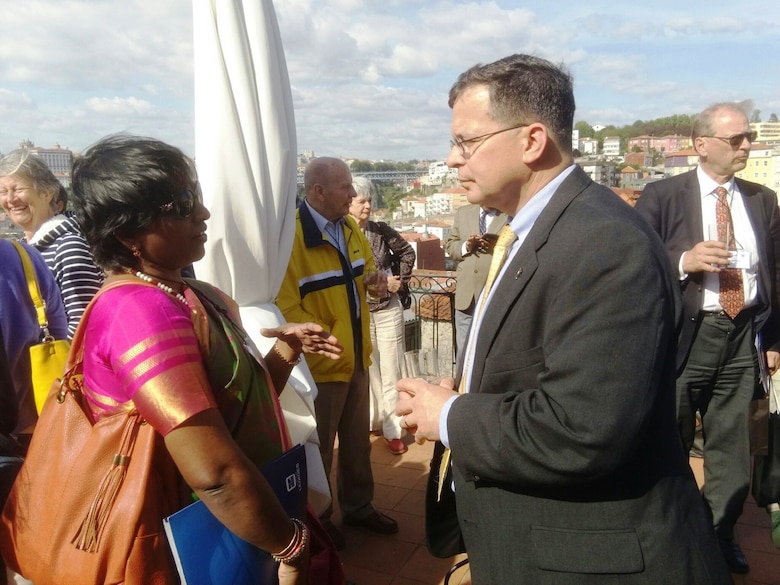 Major General Peabody, US Section President, speaking with Ms. Sai Amutha Devi, Delegate from the Indian Section, overlooking the Douro River in Porto, Portugal.  