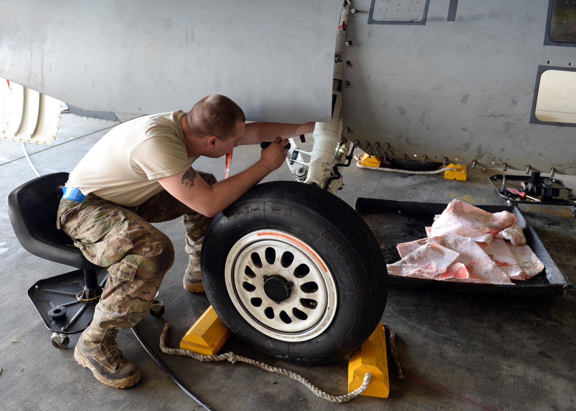 U.S. Air Force Staff Sgt. William Reibsome, 455th Expeditionary Maintenance Squadron F-16 Fighting Falcon aircraft maintainer, performs a routine check on a jet May 3, 2015, at Bagram Airfield, Afghanistan. Reibsome, who is part of the ‘1000s of Hands’ project is responsible for keeping the jets flying by doing repairs, running tests, changing tires and when needed responding to in-flight and ground emergencies. (U.S. Air Force photo by Senior Airman Cierra Presentado/Released)