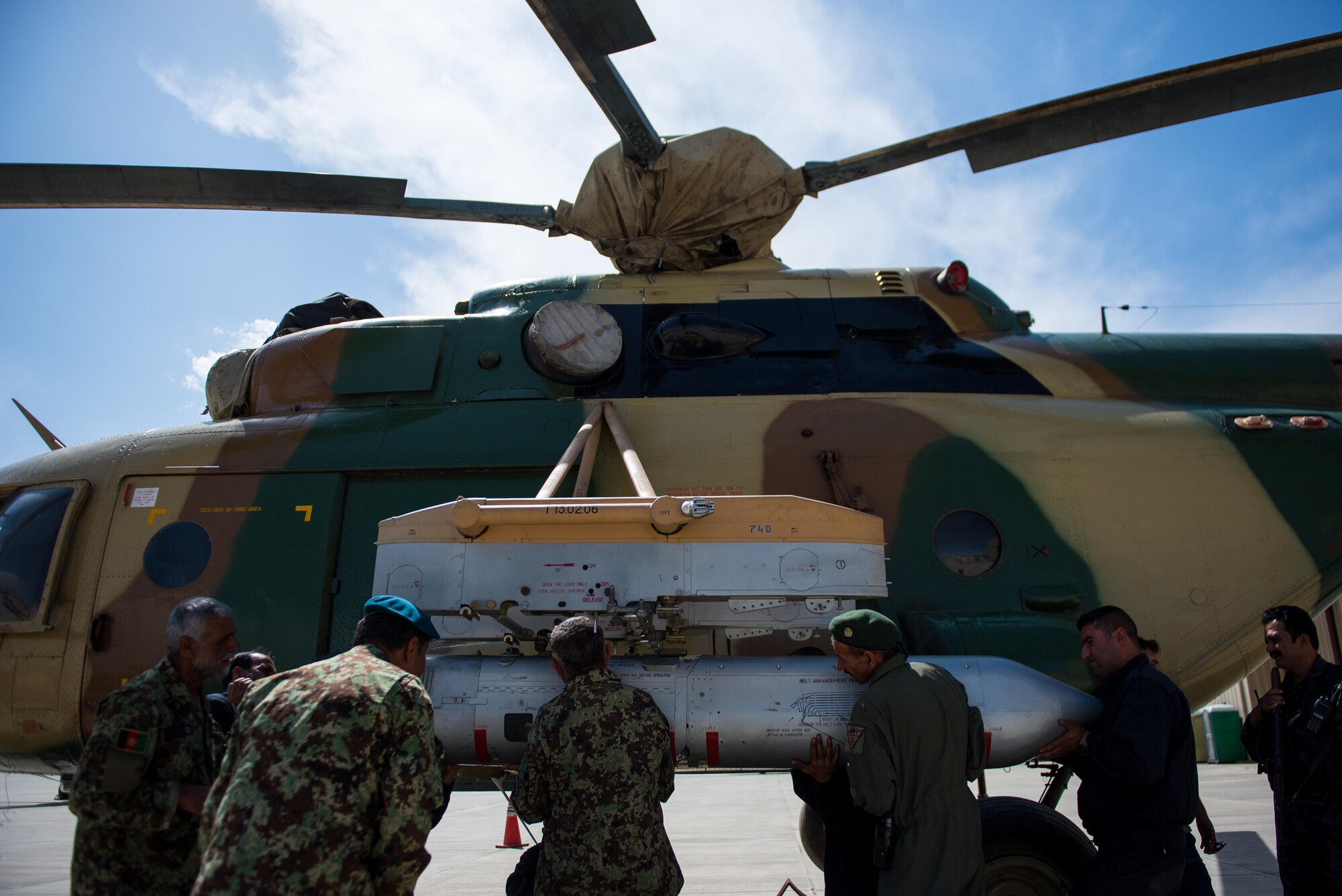 Afghan Air Force airmen install a GSh-23 dual-barrel, 23 mm cannon on a Mi-17 helicopter at Kabul Air Wing, Afghanistan, May 18, 2015. The weapons system was boresighted for accuracy before mounting. (U.S. Air Force photo by Tech. Sgt. Joseph Swafford/Released)