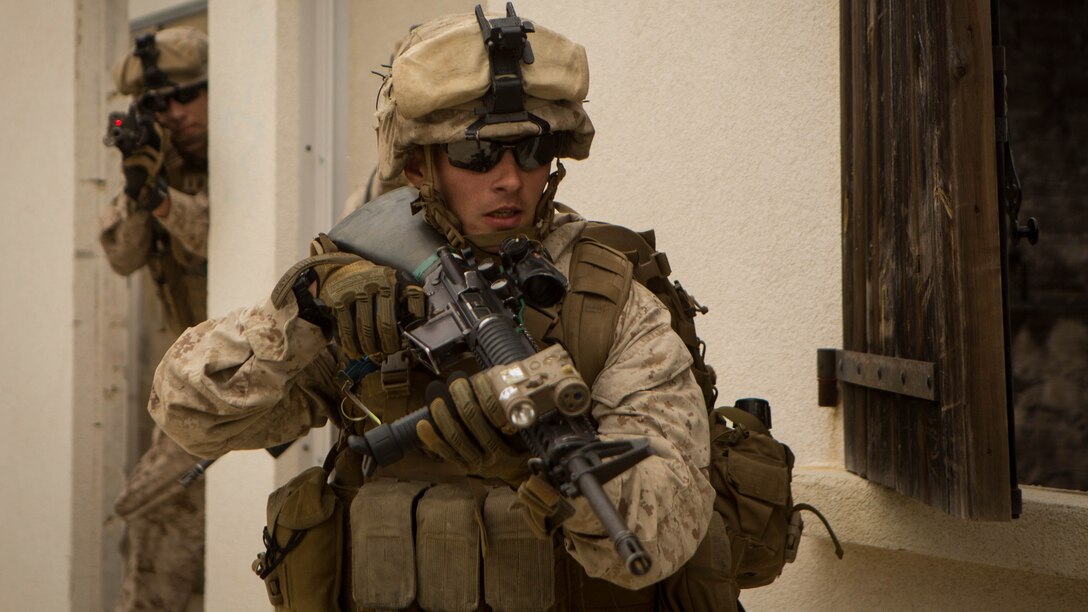 U.S. Marine Corps Lance Cpl. Mark Dupuis, a rifleman with Special-Purpose Marine  Air-Ground Task Force Crisis Response-Africa, moves toward cover during a seize and capture training exercise on Quartier Colonel de Chabrieres, France, May 29, 2015. Marines conducted the joint exercise with service members from the French Foreign Legion’s 6th Light Armored Brigade to further improve interoperability between the two NATO forces as they concurrently deploy their service members to Africa. 