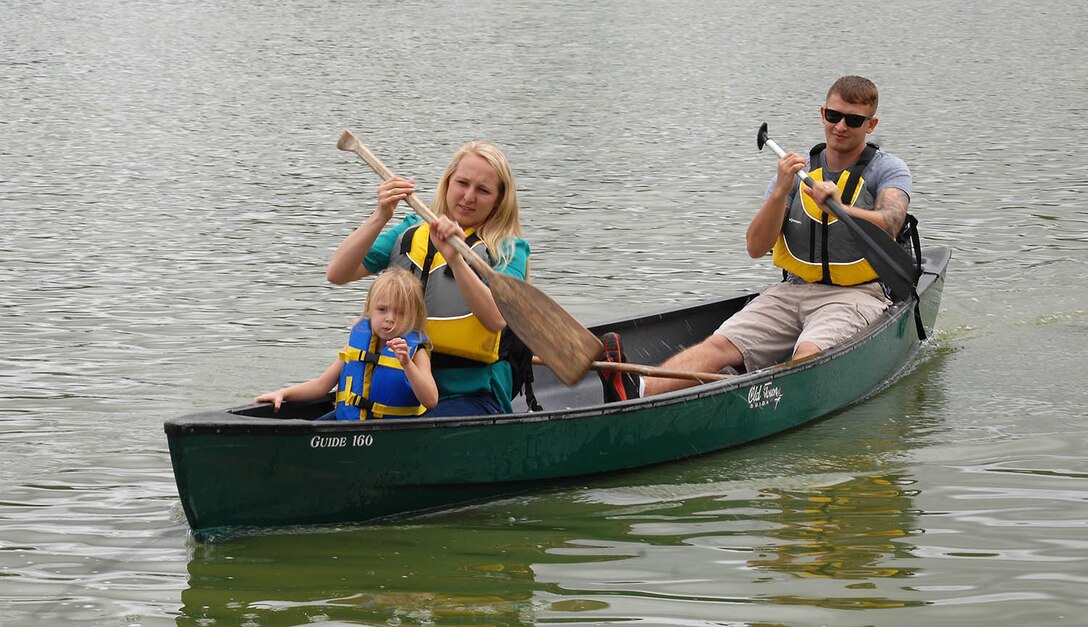 The Baltrusch family canoes around Covella Pond during the Combined Unit and Family Fun Day at Marine Corps Logistics Base Albany, June 4.